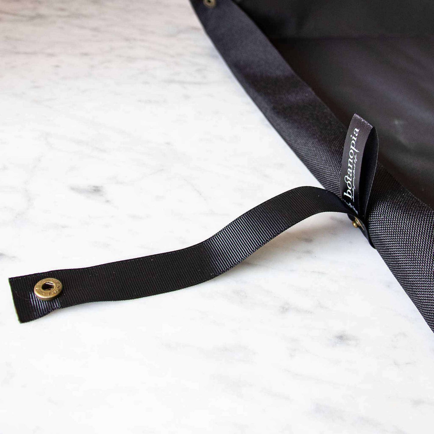 
                  
                    Potting tarp for urban gardening: Vegan black ribbon - Curated Home Decor
                  
                