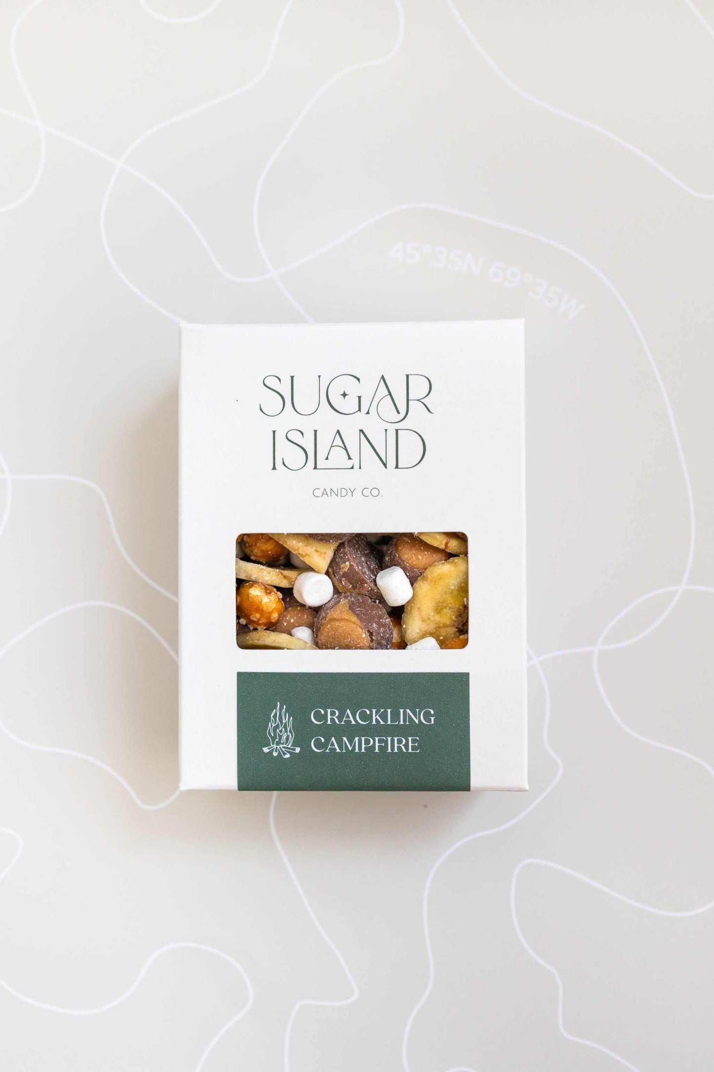 Sugar Island Crackling Campfire Candy mix with mini marshmallows, buckeyes, banana chips, and pretzel balls in a white box