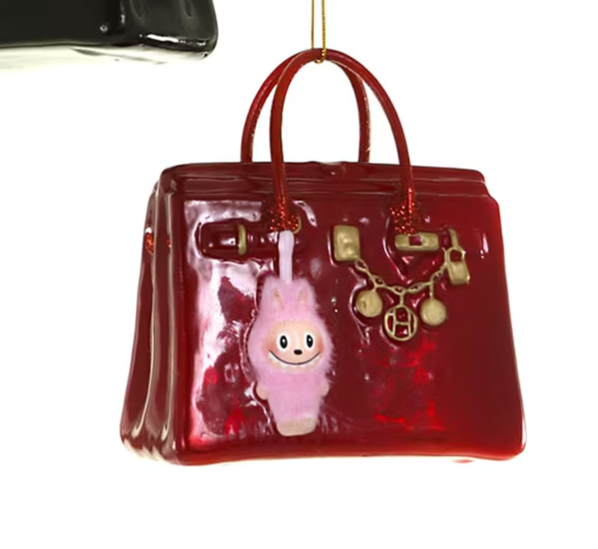 Christmas Carousel Collection red glass luxe bag ornament with pink monster charm