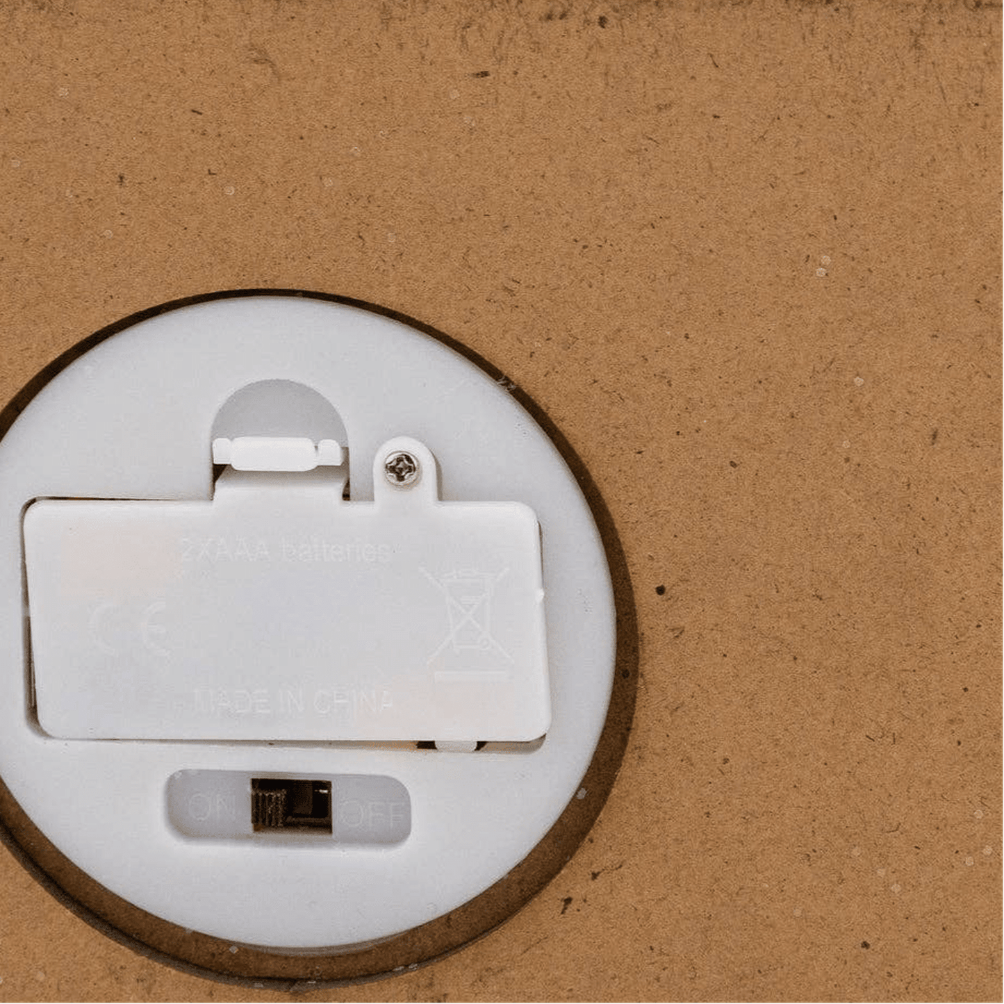 
                  
                    Battery compartment and switch of Haunted Village Decor Dead & Breakfast Halloween decoration with battery-powered light.
                  
                