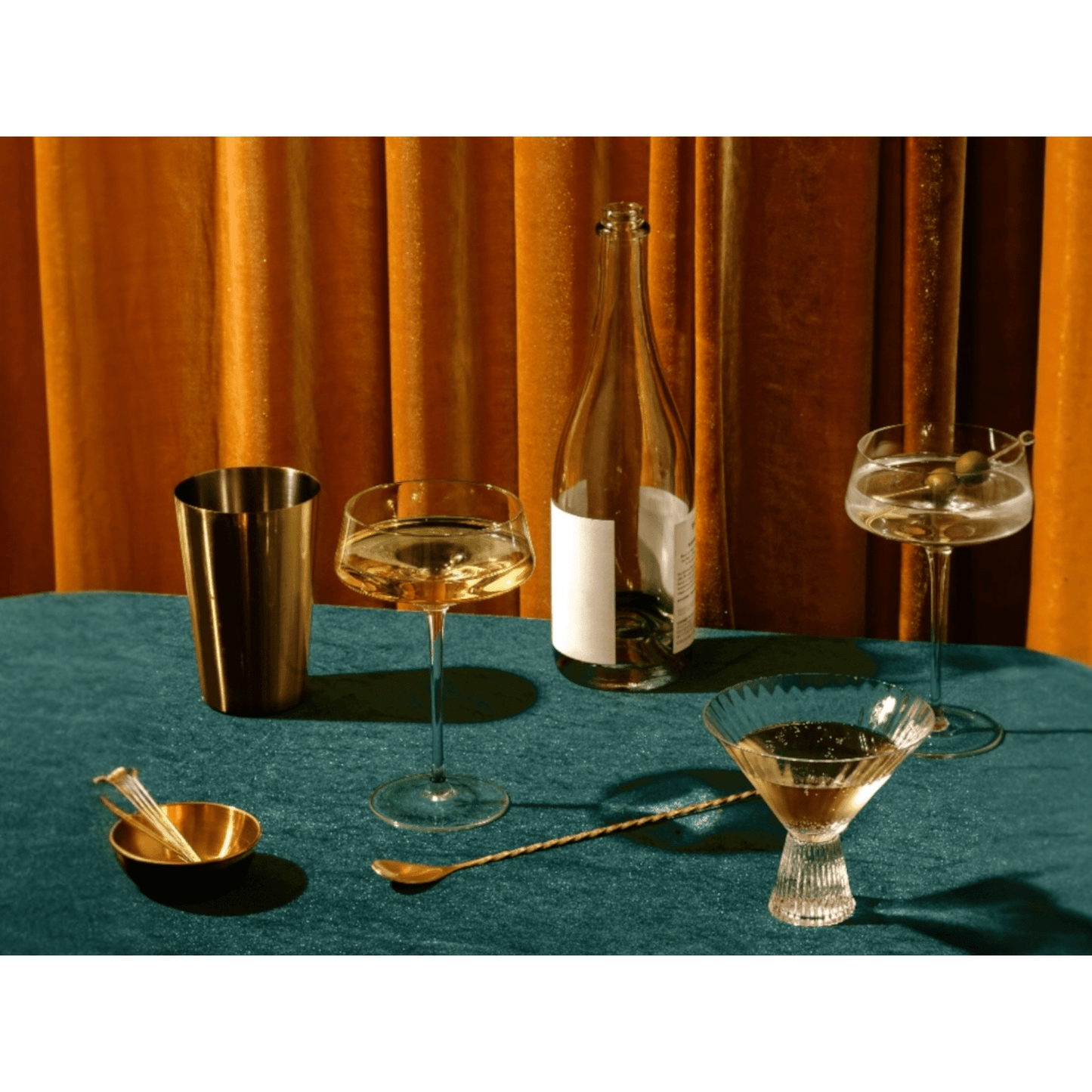 Pebbled long brass bar spoon with hammered texture and matte gold finish