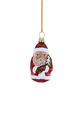 Vintage Belsnickel ornament with red outfit and small Christmas tree decoration hanging by gold string