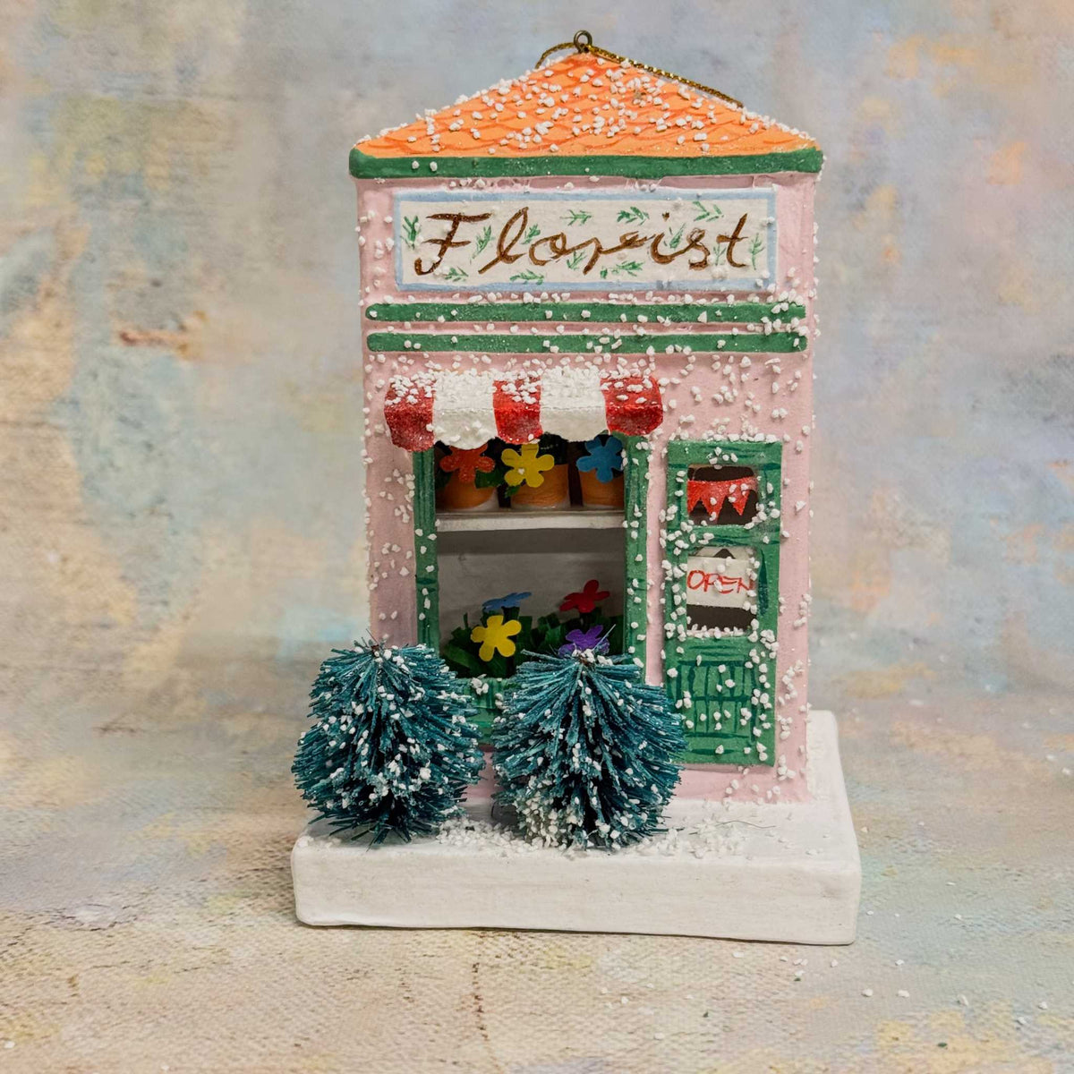 
                  
                    European Village Shop paper ornament florist shop with snow and festive details
                  
                