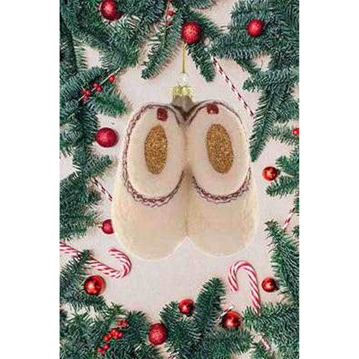 
                  
                    Hand-painted fleece slippers ornament with gold glitter soles hanging on Christmas tree with candy canes and red baubles
                  
                