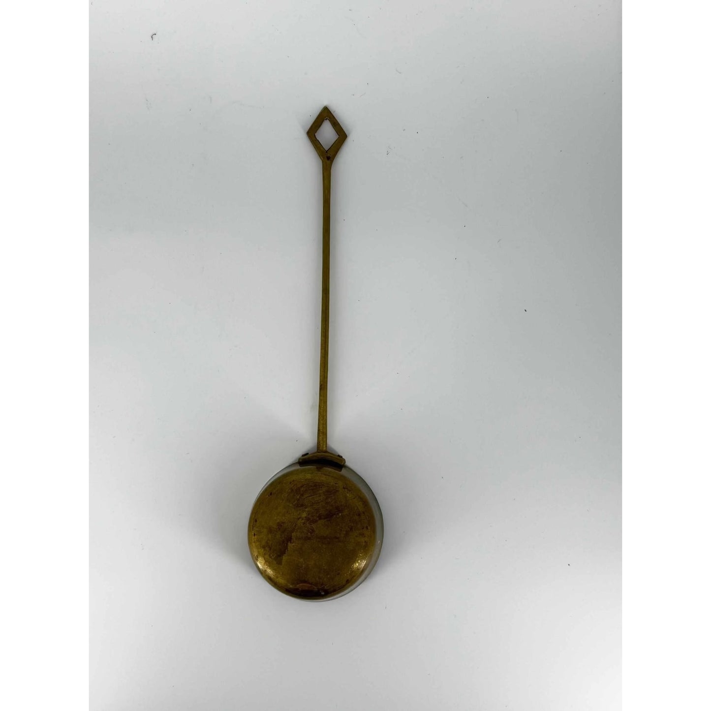 
                  
                    vintage brass ladle with diamond-shaped handle and round bowl for serving and decoration
                  
                
