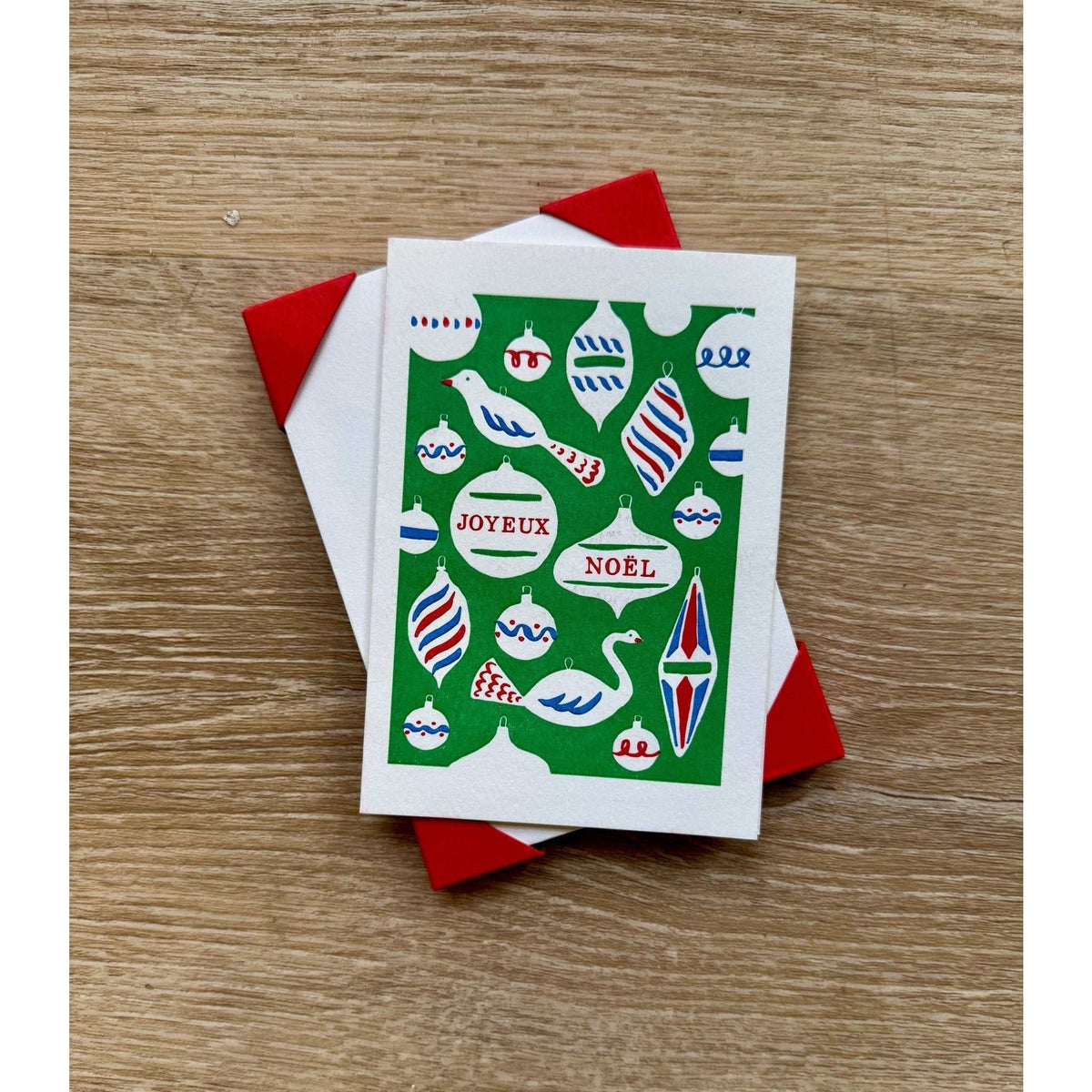 Hand-printed letterpress Christmas card with festive ornaments on cotton paper and red envelope