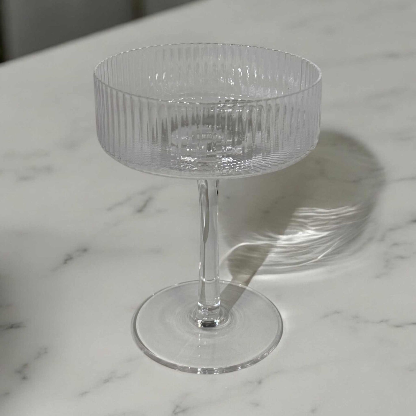 Clear 8 oz cocktail coupe glass with intricate line detailing and premium optic glass design