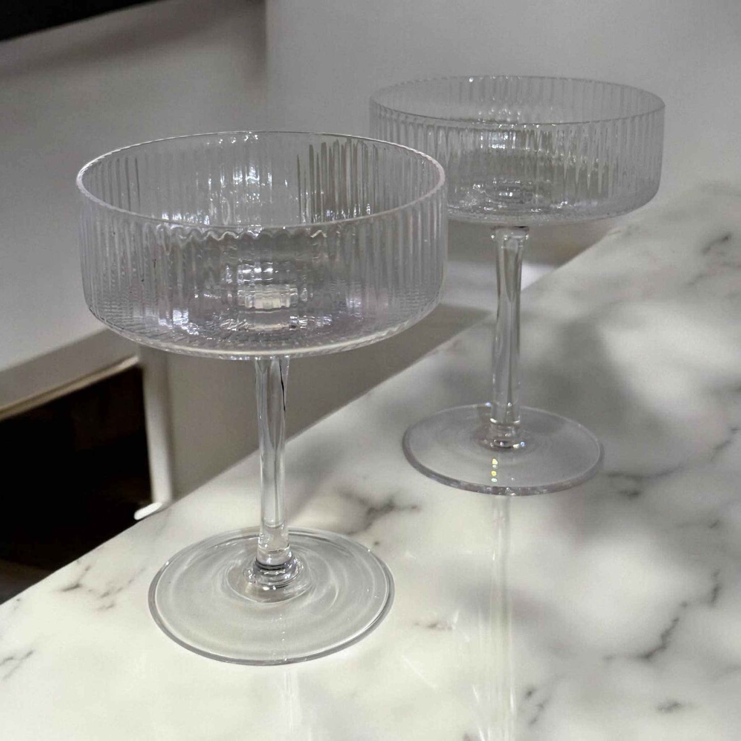 Clear 8 oz cocktail coupe glass with intricate optic line detailing and durable premium glass design