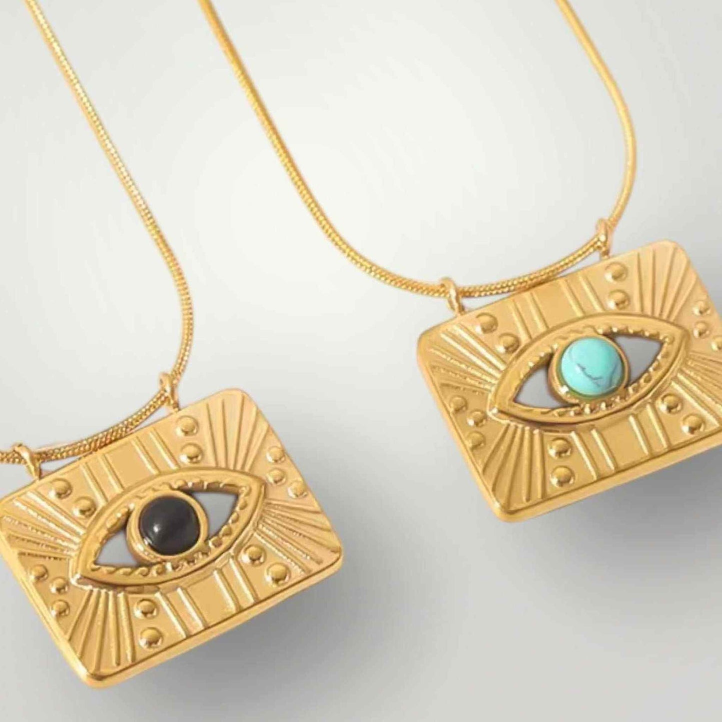 Two 18K gold filled evil eye pendants with black and turquoise center stones on gold chains