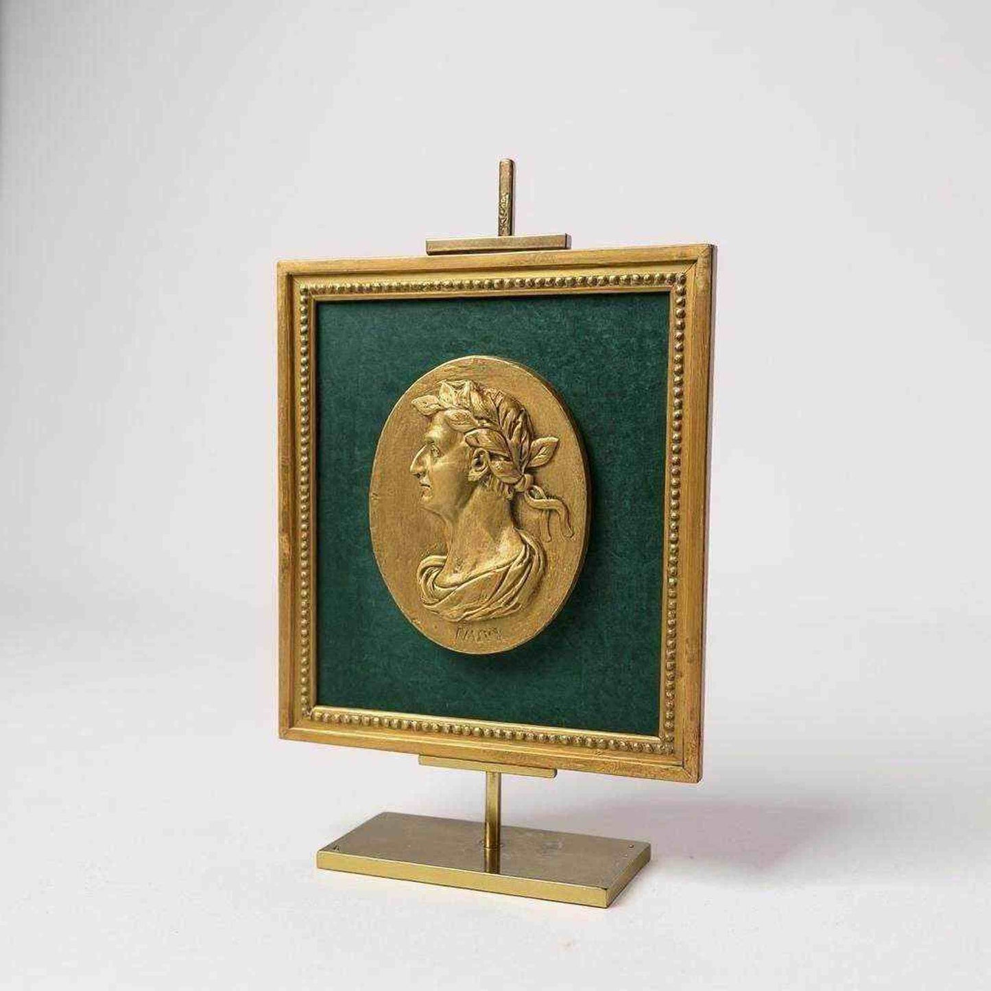 Framed bas-relief medallion of Julius Caesar in gold finish on green velvet with gilt beaded frame and IVLIVS inscription