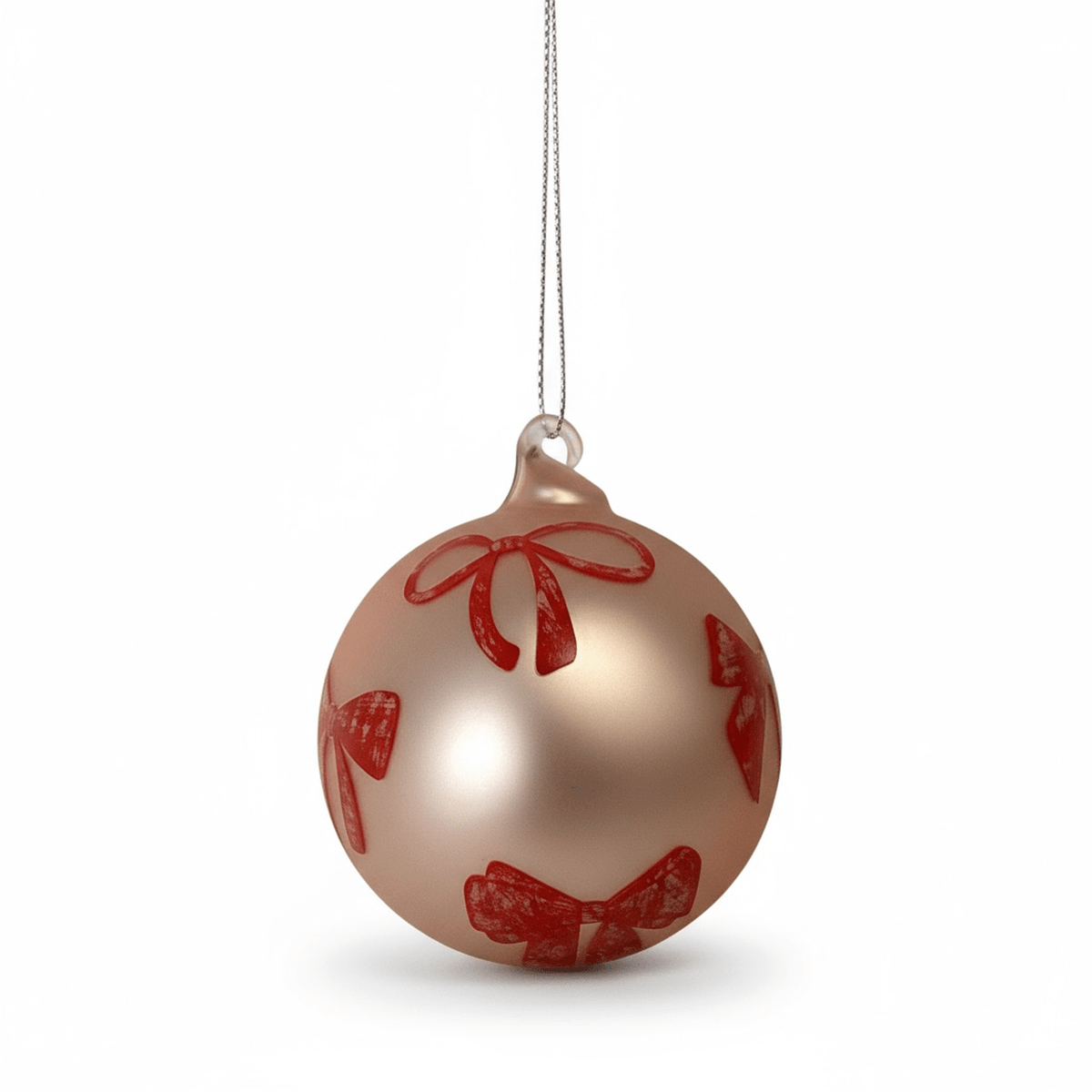 Champagne gold glass bauble with hand-painted pink bows holiday ornament