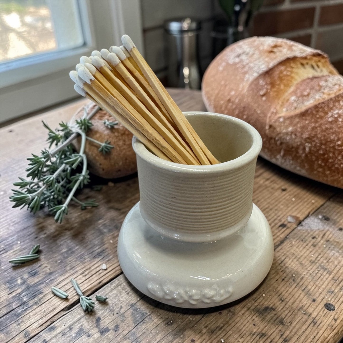 Vintage French match striker in white porcelain with minimalist design and 19th-century charm