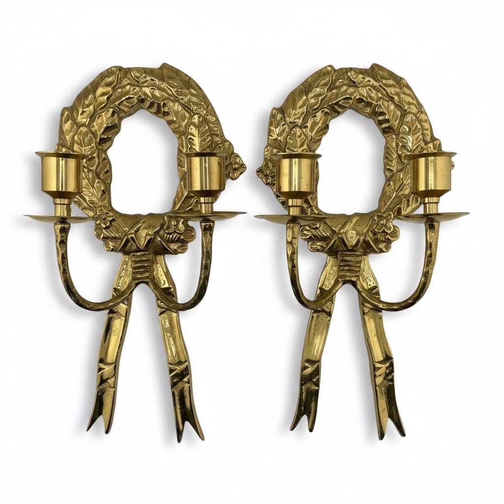 Vintage pair of brass wreath candle sconces with laurel detailing and warm patina, mid-20th century design