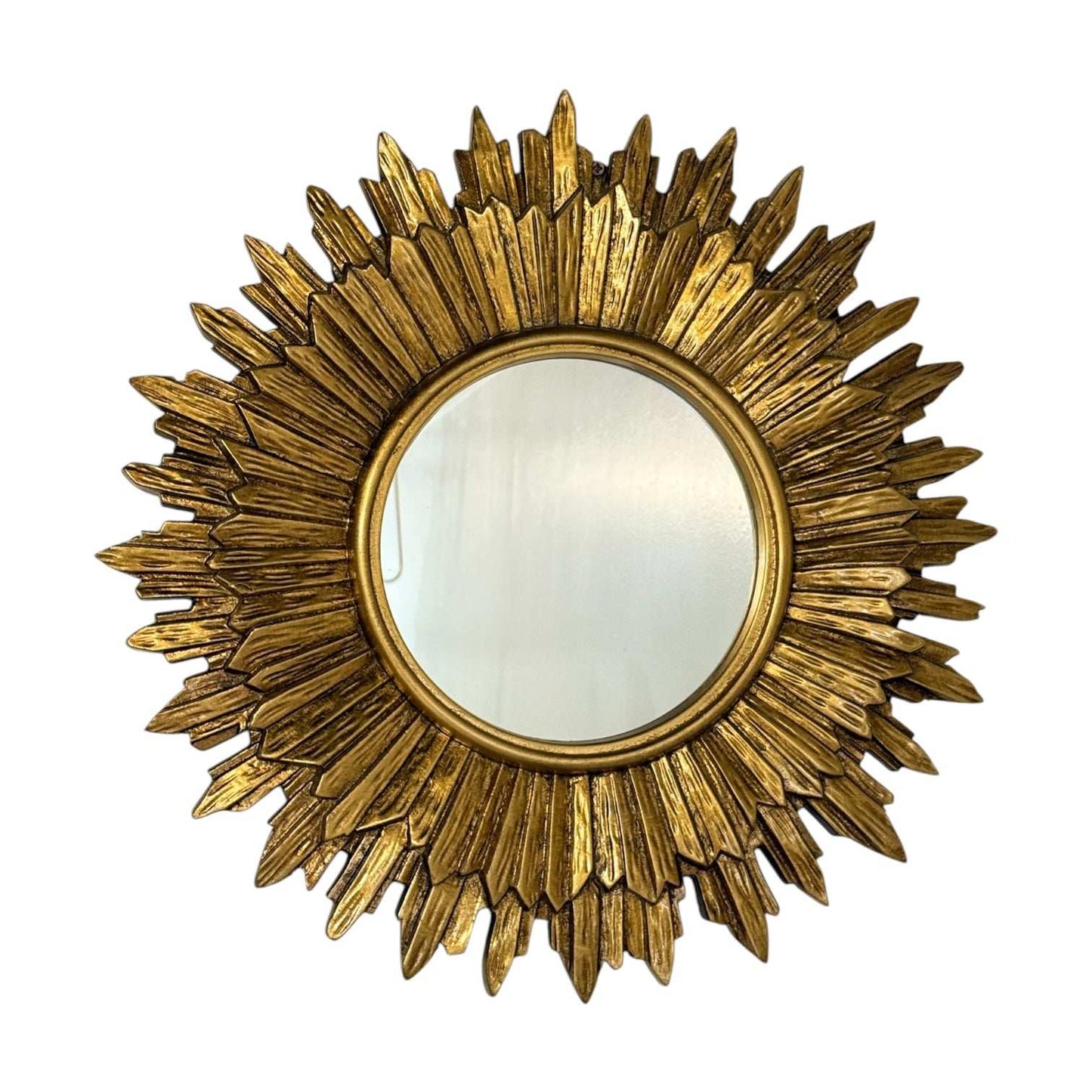 Vintage gilt sunburst mirror with gold leaf finish and beveled center, 17.5-inch diameter