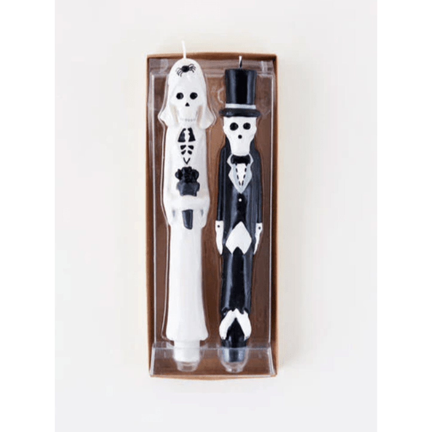 Newlydeads taper candle set featuring Halloween bride and groom skeletons in wedding attire