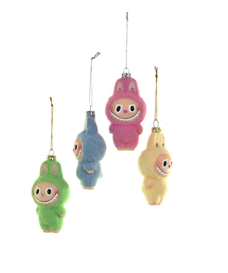 Set of four assorted fuzzy monster ornaments with colorful glass and playful fuzzy details for holiday decoration