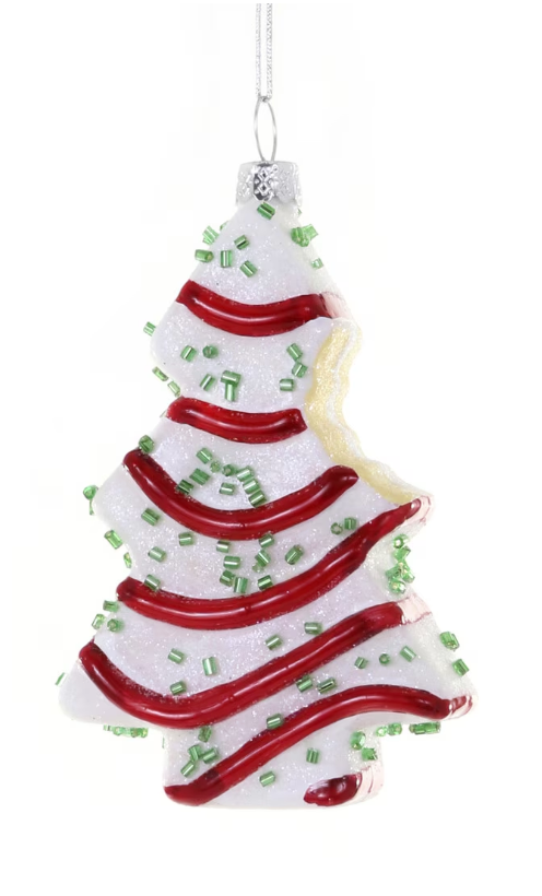 Christmas tree cake ornament with a bite taken out, glass decoration with red and green details for holiday décor
