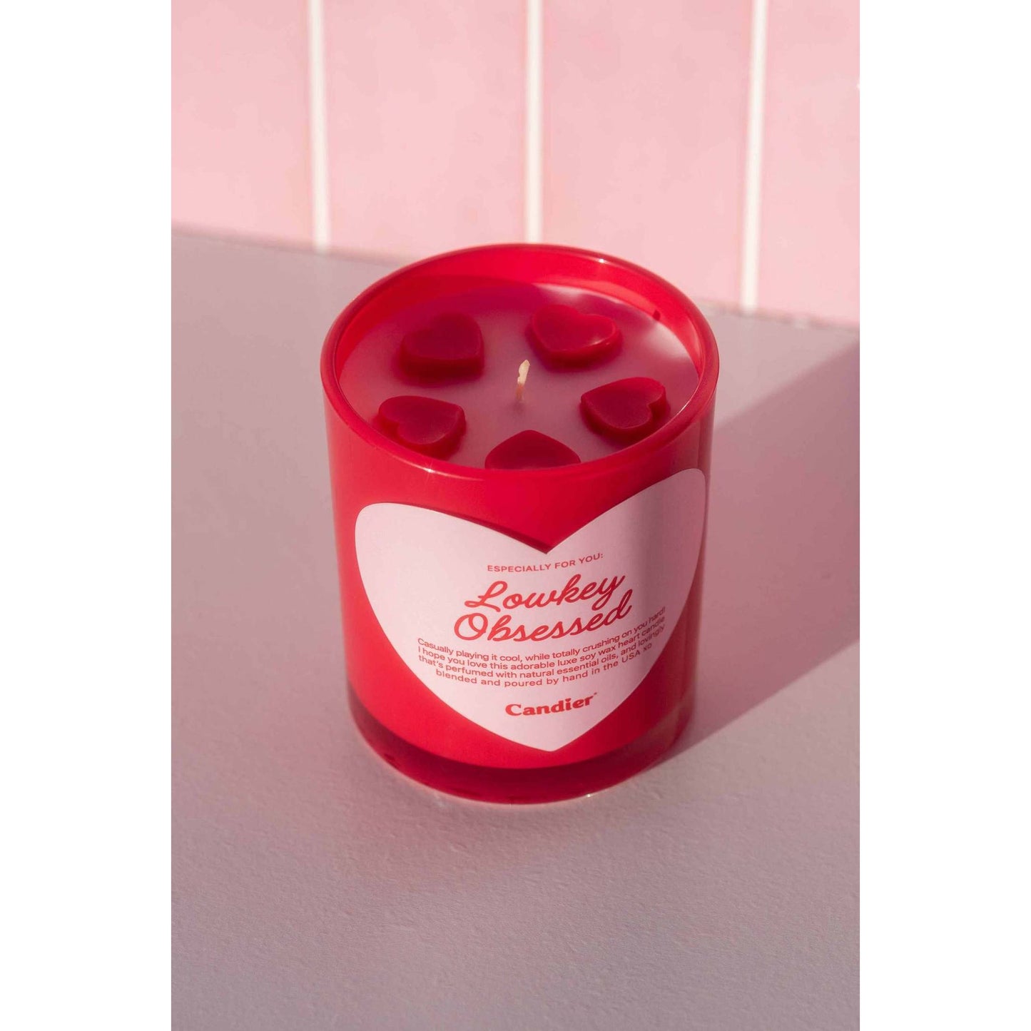 Lowkey Obsessed Candle in red jar with heart-shaped wax pieces, decorative gift candle