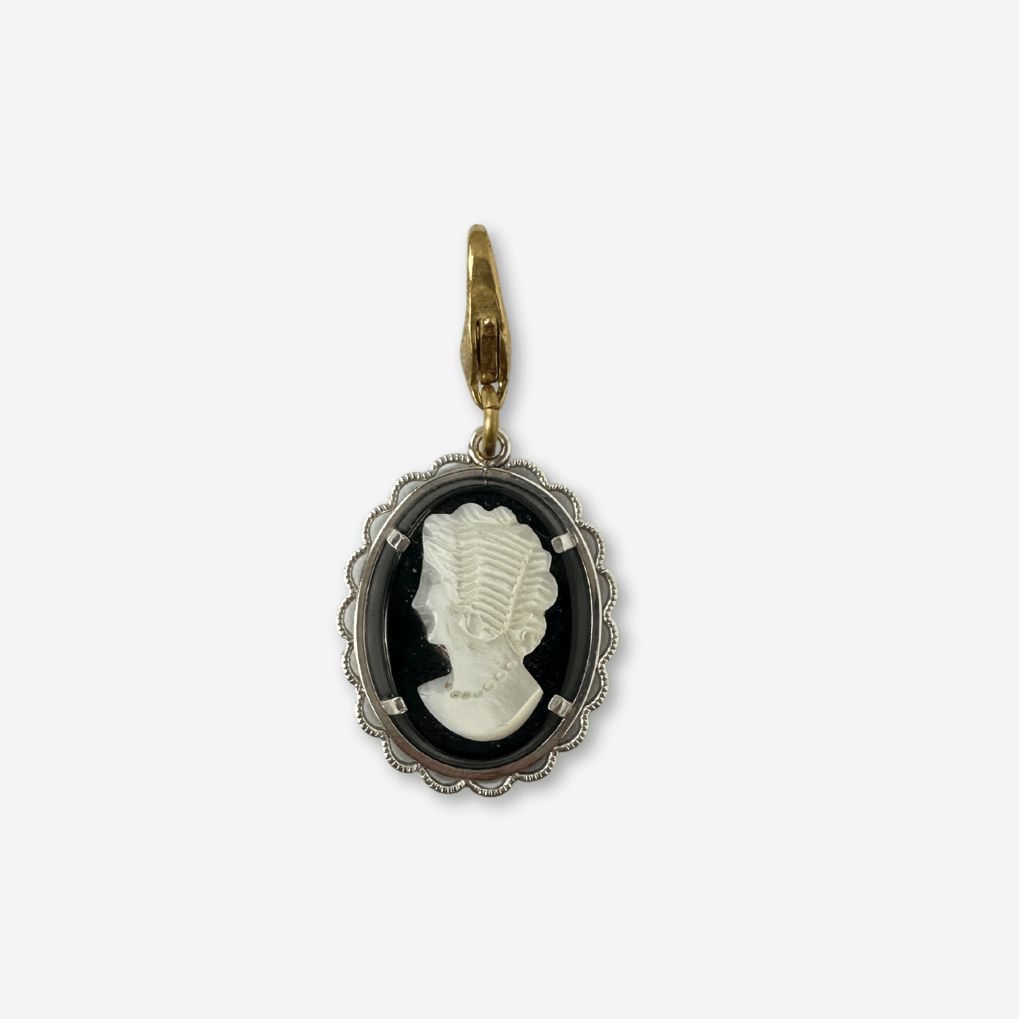 Vintage black and white cameo charm with silver setting and brass lobster clasp