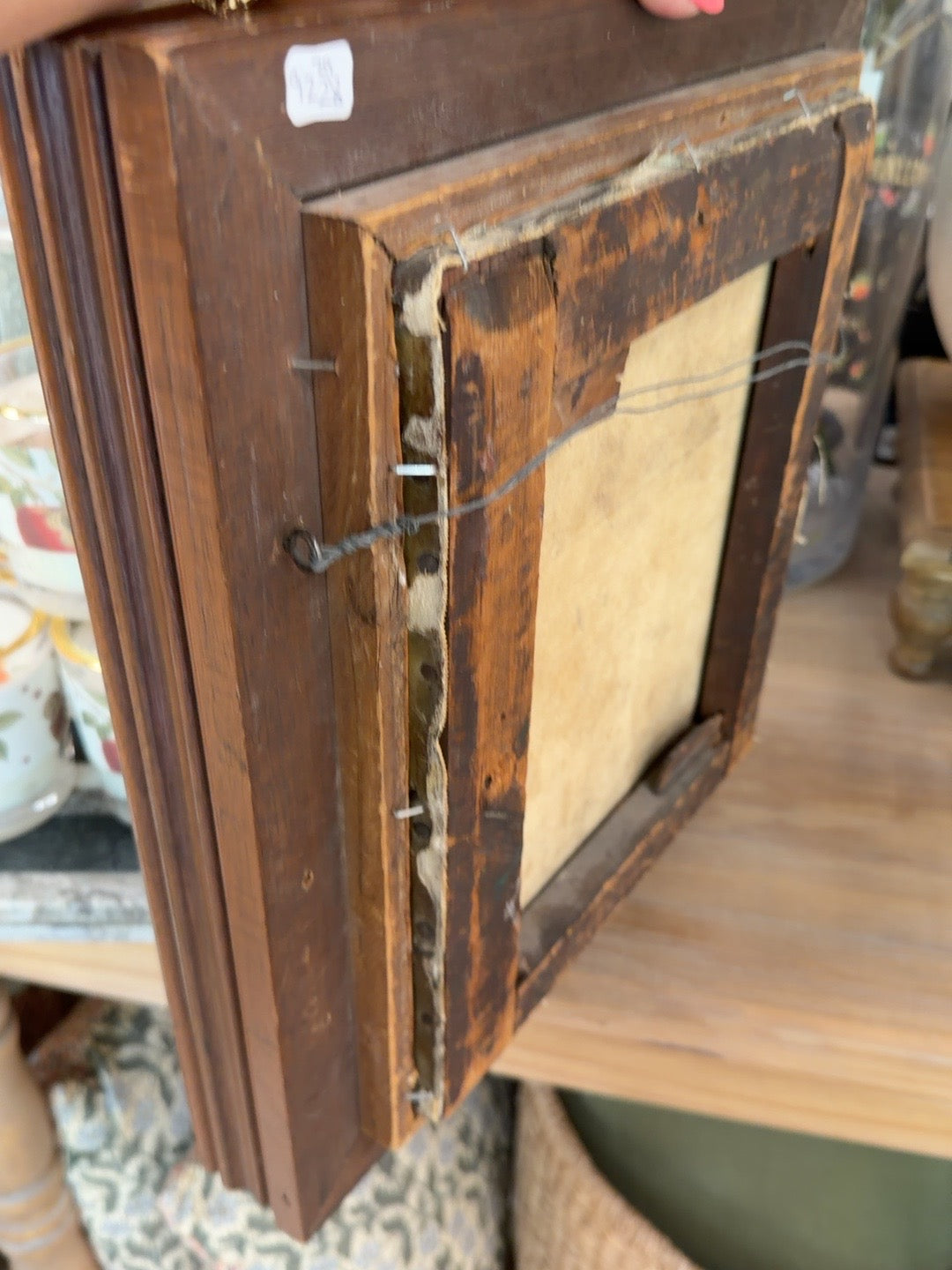 
                  
                    Side and back detail of antique wood frame and canvas construction
                  
                