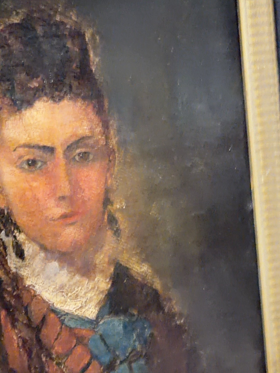 
                  
                    Close detail of antique portrait painted surface and age-related texture
                  
                
