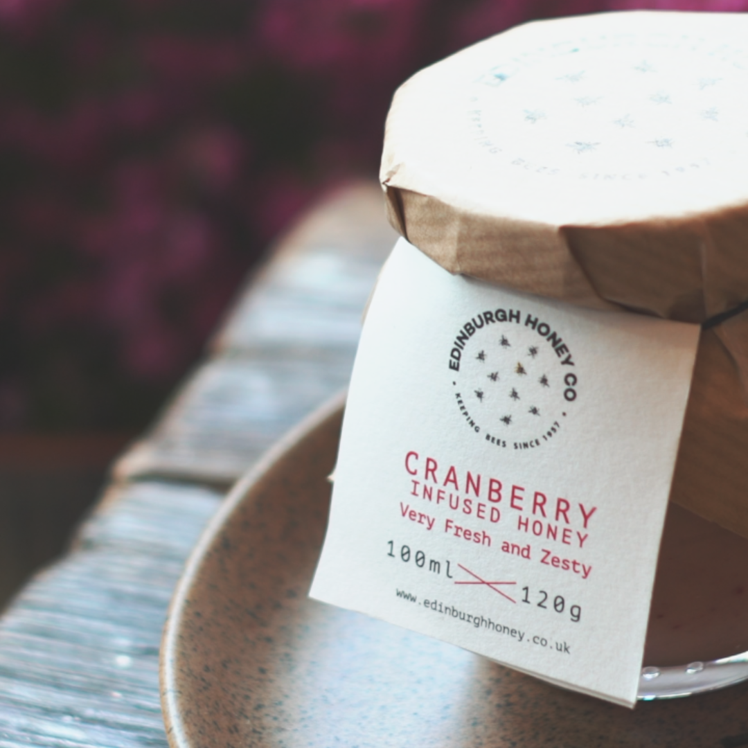 Jar of Cranberry Infused Honey from Edinburgh Honey Co in eco-friendly packaging
