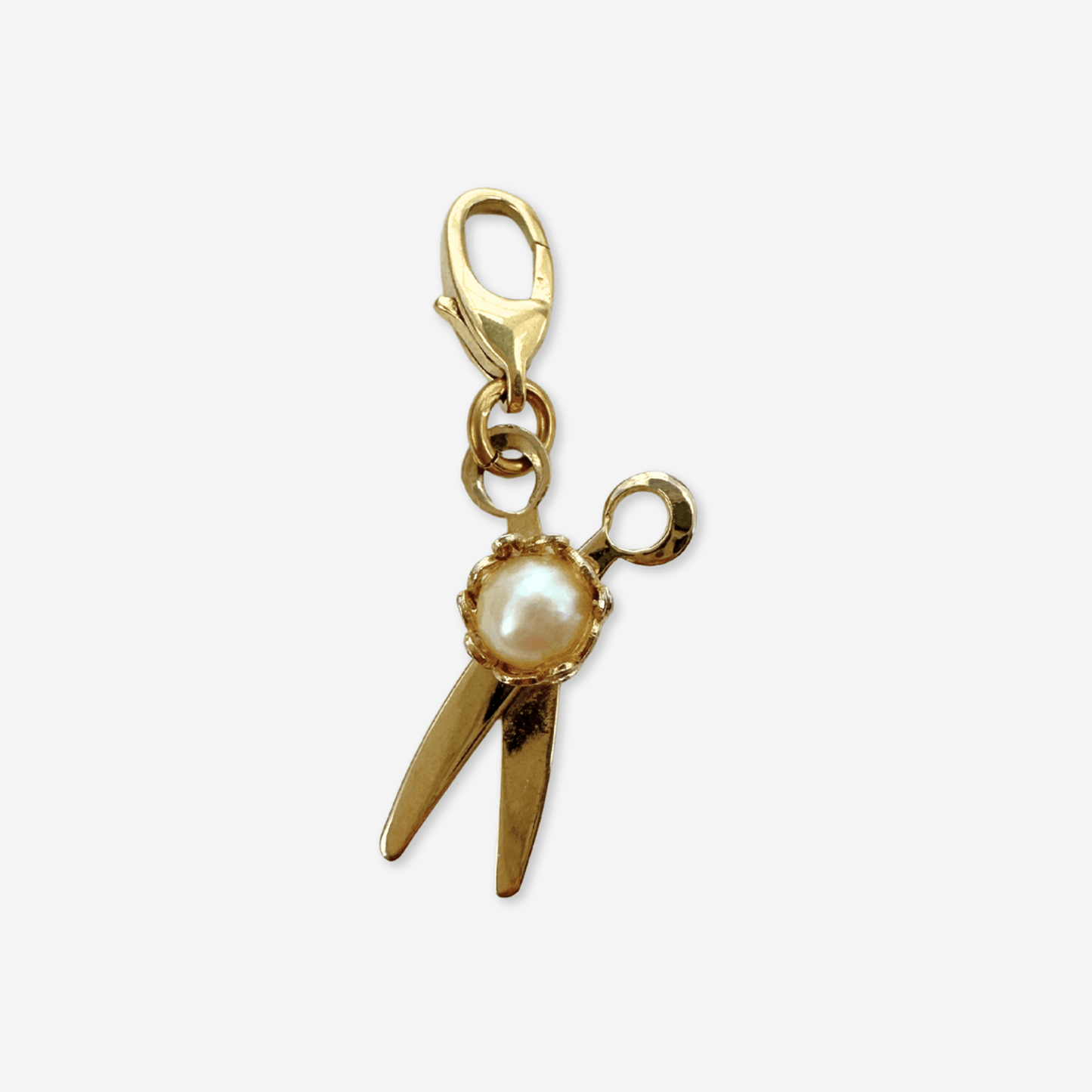 Small vintage gold plated scissors charm with pearl center and functioning hinge