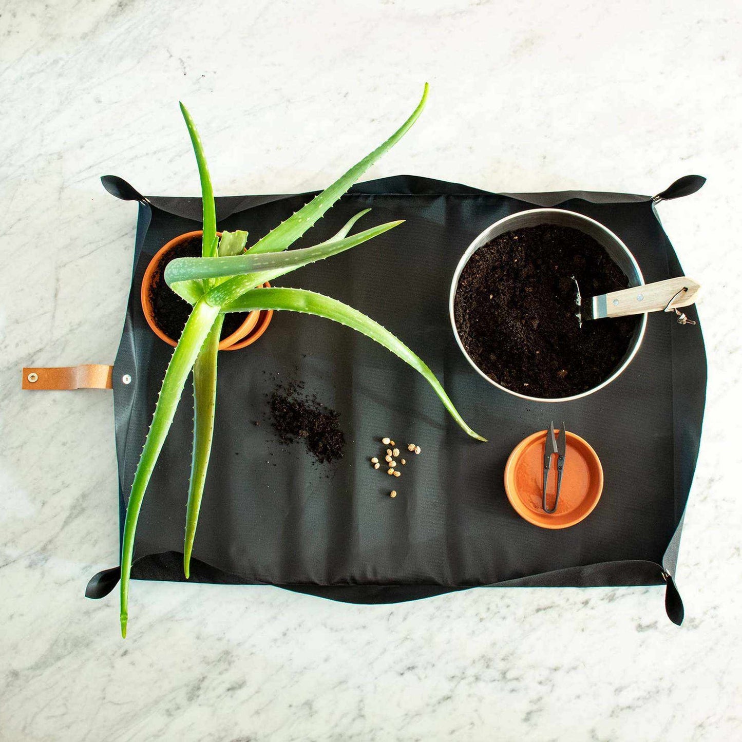 
                  
                    Potting tarp for urban gardening: Vegan black ribbon - Curated Home Decor
                  
                