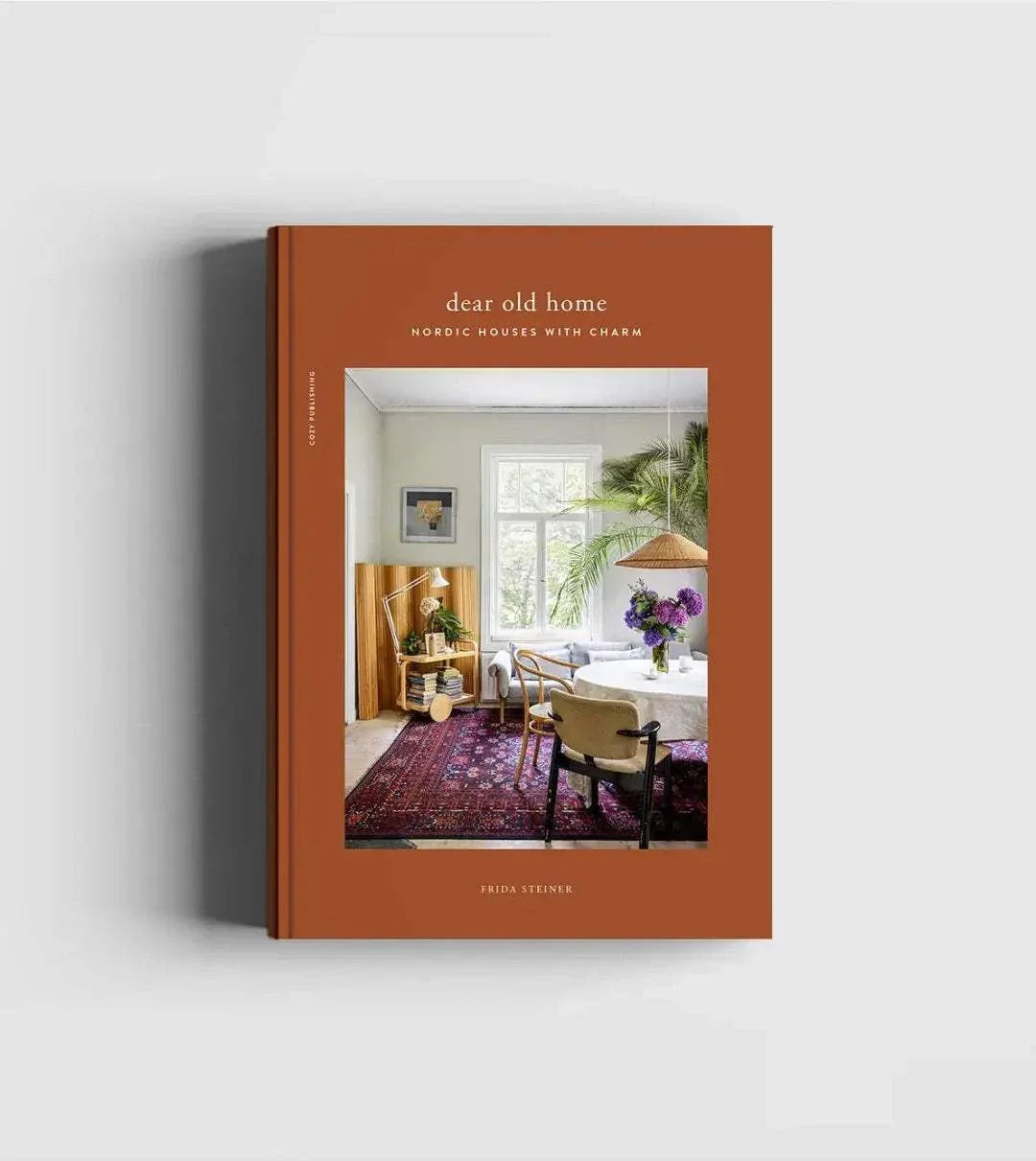 Dear Old Home book cover featuring Nordic interior design with cozy dining area and warm earthy tones