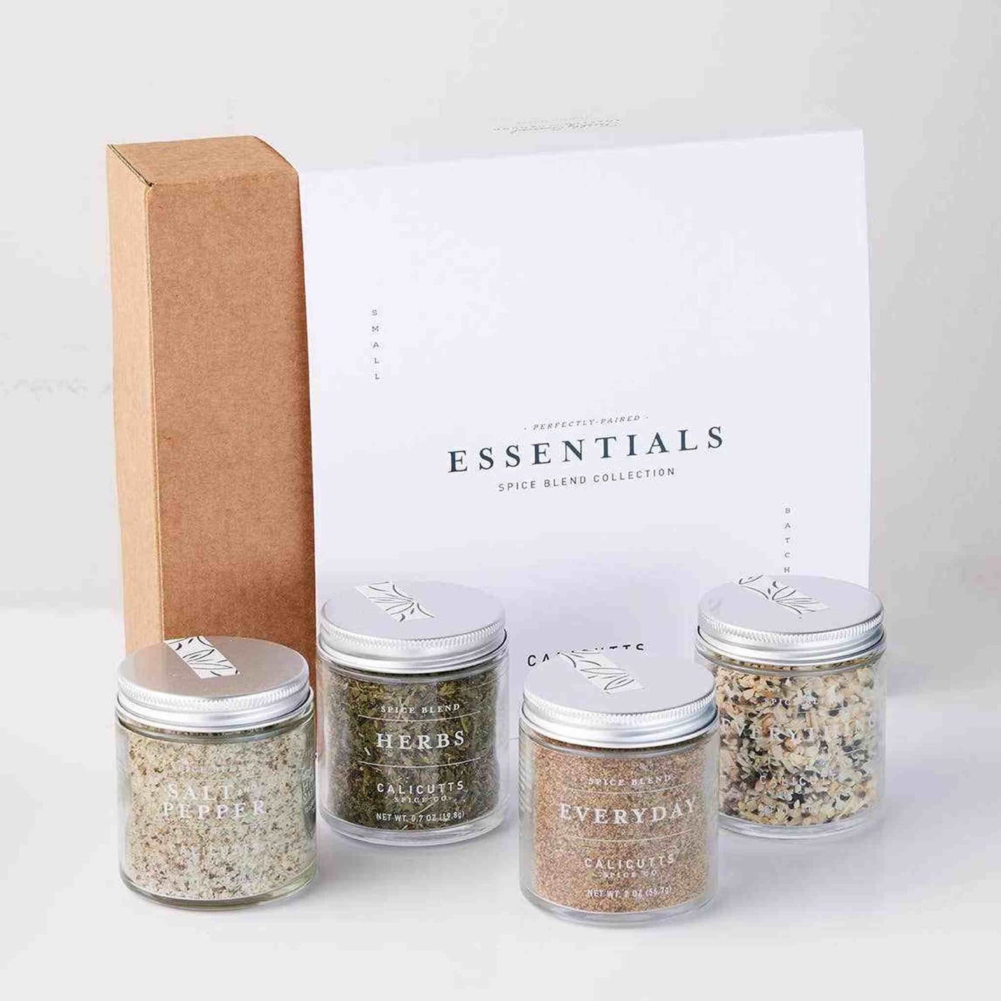 
                  
                    Essentials Gift Set with handcrafted preservative-free spice blends including Salt & Pepper, Herbs, Everyday, and Everything in glass jars with a white box packaging
                  
                