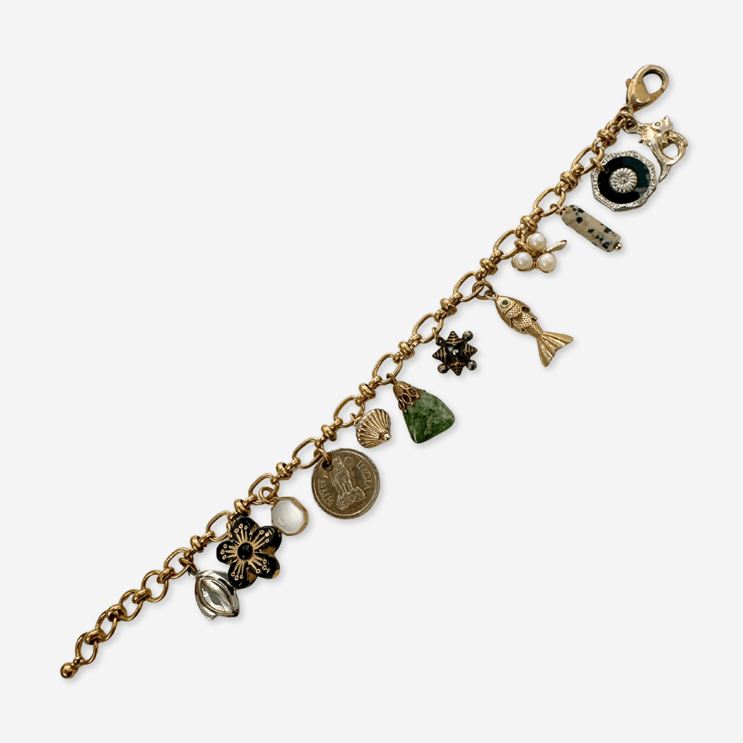 Repurposed vintage mixed charm bracelet with buttons, beads, raw brass oval link chain, and lobster clasp