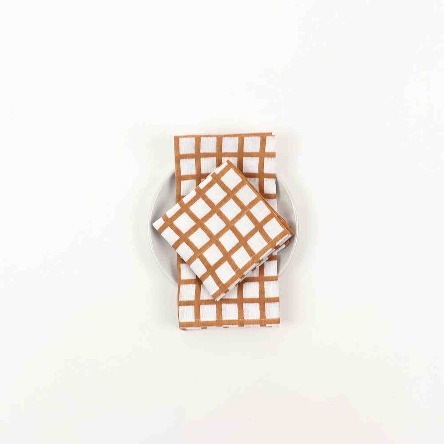 Linen hand block napkin with brown check pattern on white, made from 100% European linen, handcrafted by artisans.