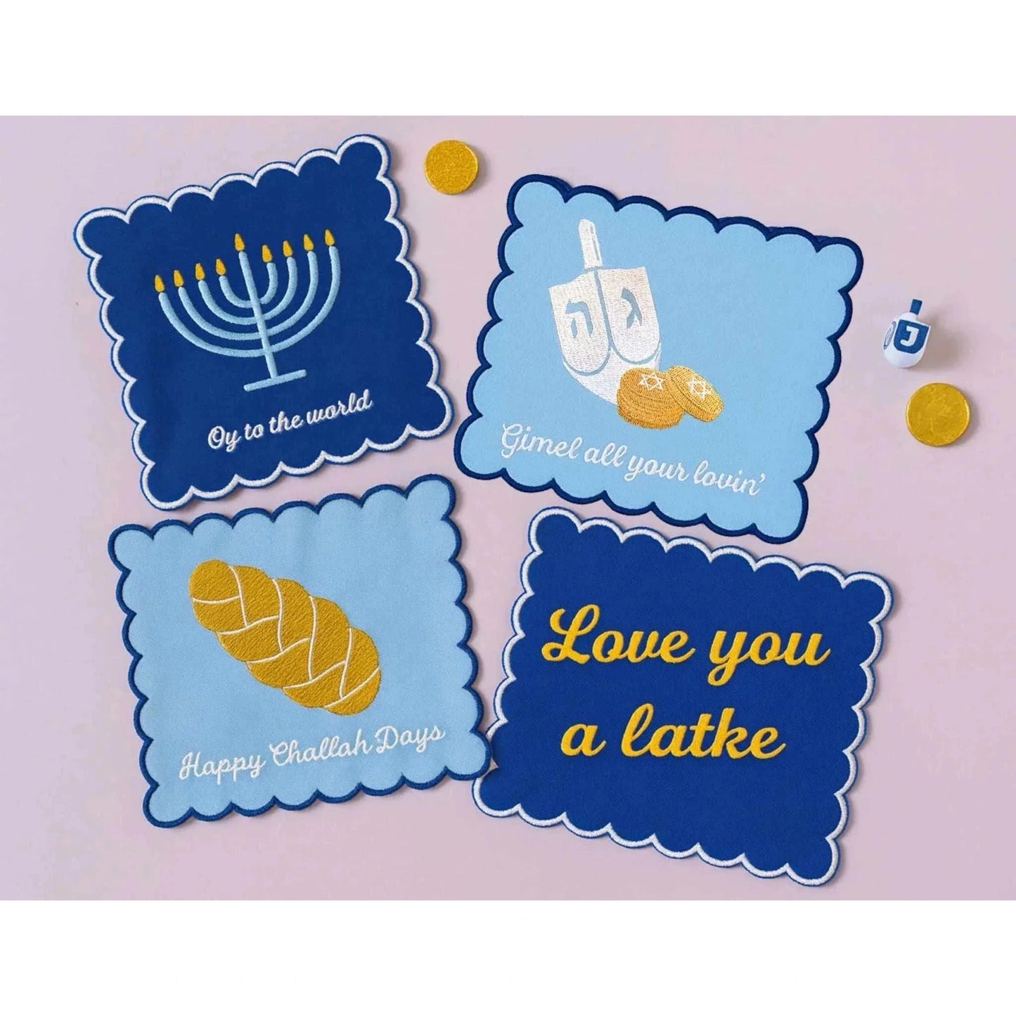 Embroidered Hanukkah Set of four cocktail napkins with festive Jewish holiday designs and phrases