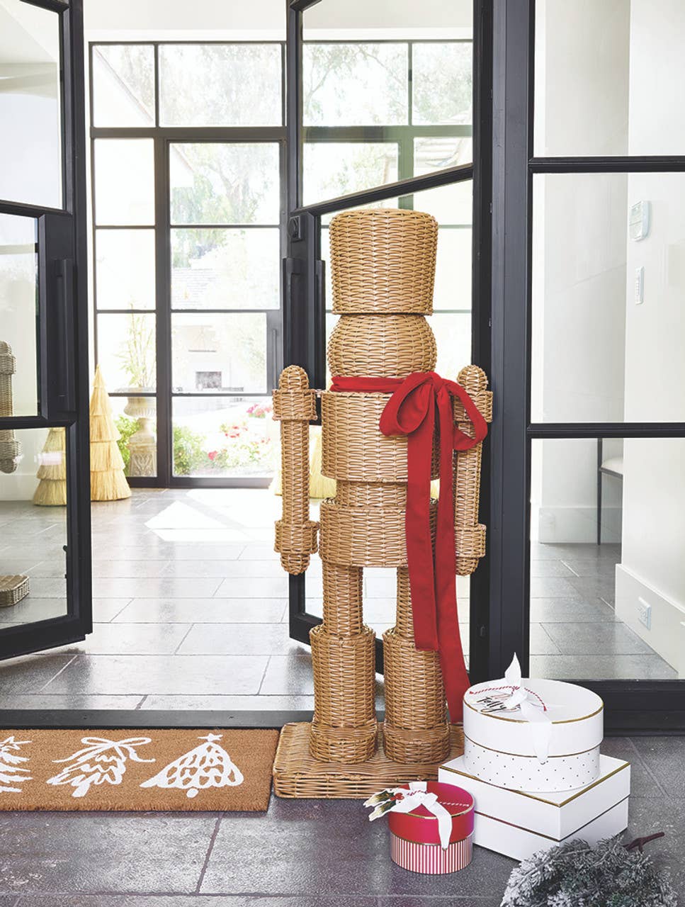 
                  
                    48-Inch All-Weather Rattan Nutcracker with Red Velvet Bow - Curated Home Decor
                  
                