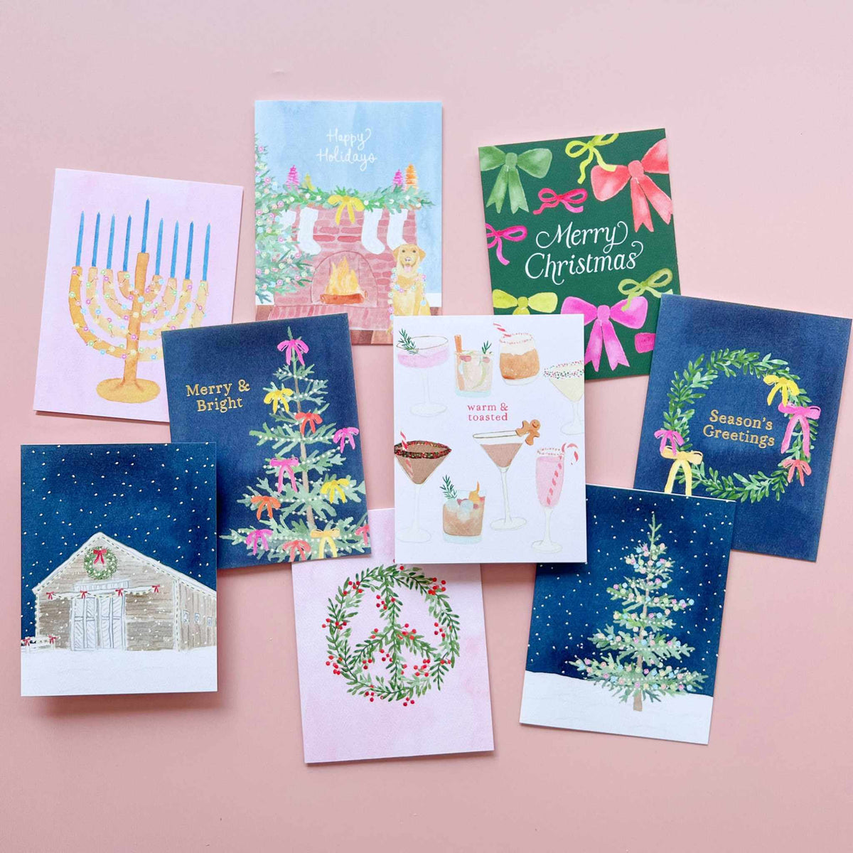 
                  
                    Chrismukkah Festive Menorah greeting card with hand-painted menorah, colorful lights, and blue candles on pink background
                  
                