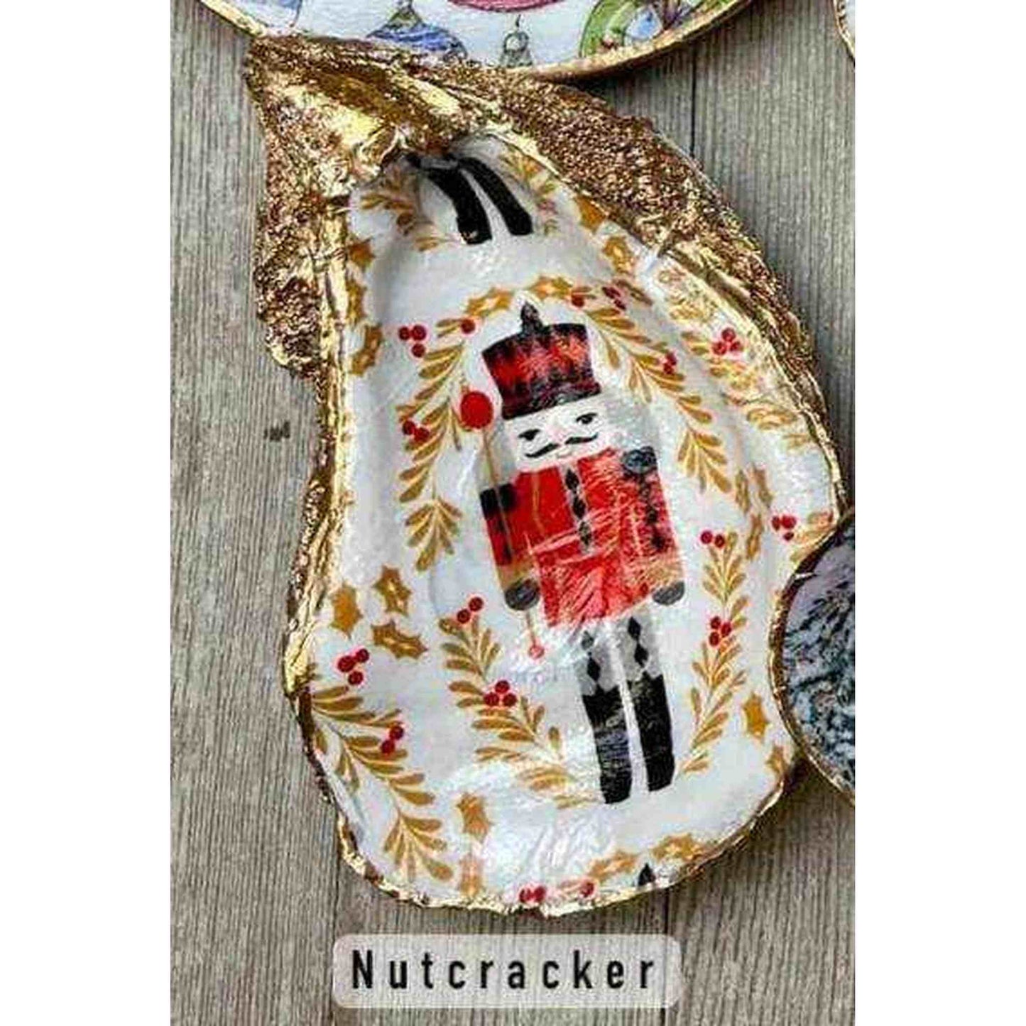 Christmas Oyster Shell Nutcracker design in real oyster shell dish with gold edges and festive decoupage decoration