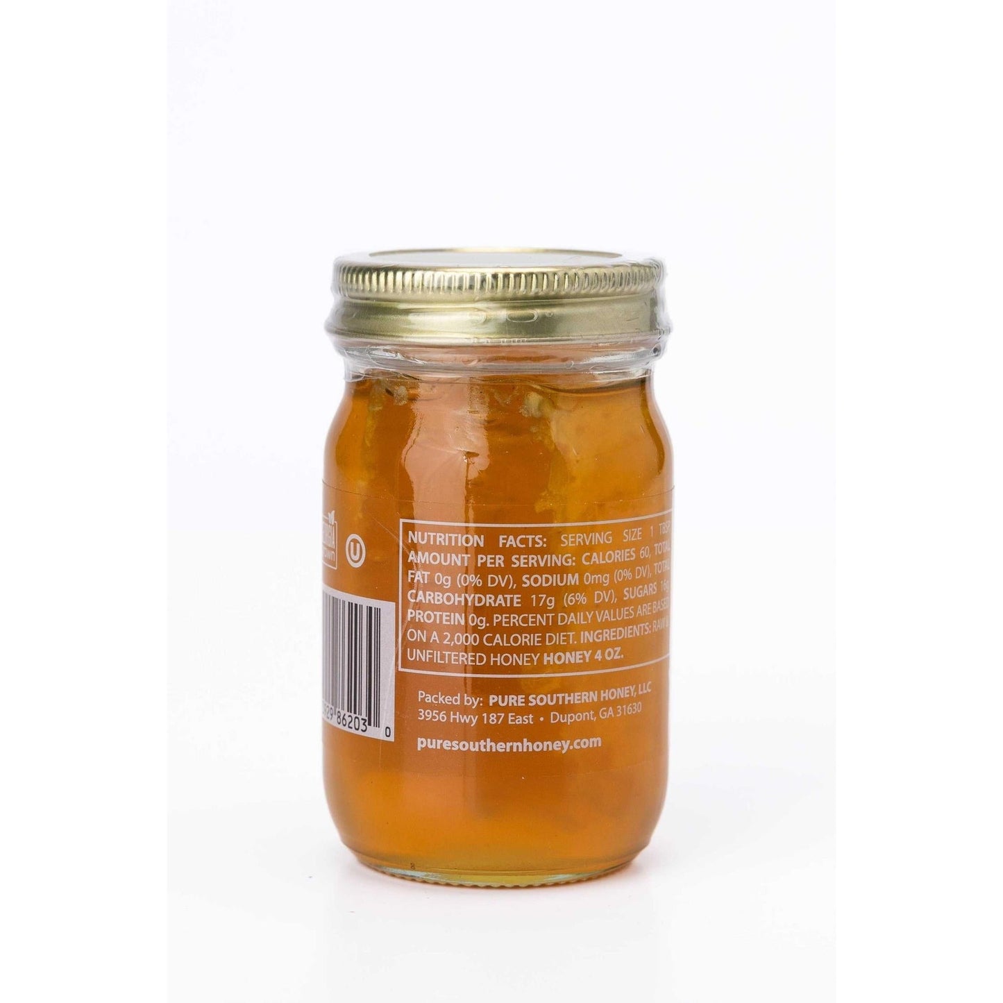 4 oz jar of mini honey with raw honeycomb in unfiltered golden honey