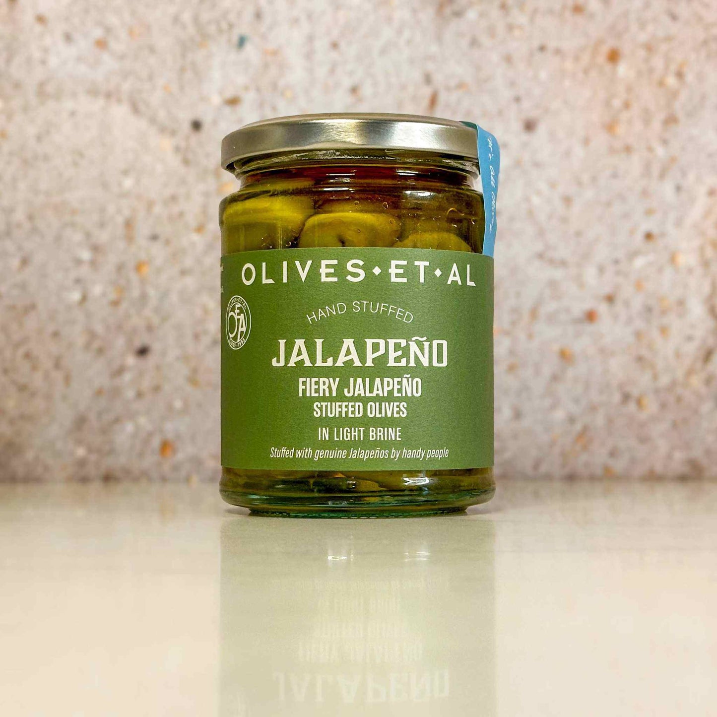 Jar of Fiery Jalapeno Stuffed Olives in light brine and extra virgin olive oil