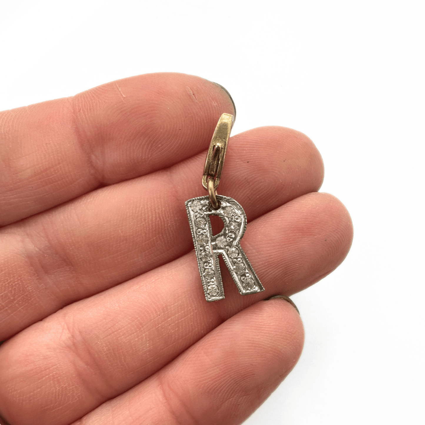 Small vintage clear rhinestone letter R charm with silver tone setting and brass lobster clasp