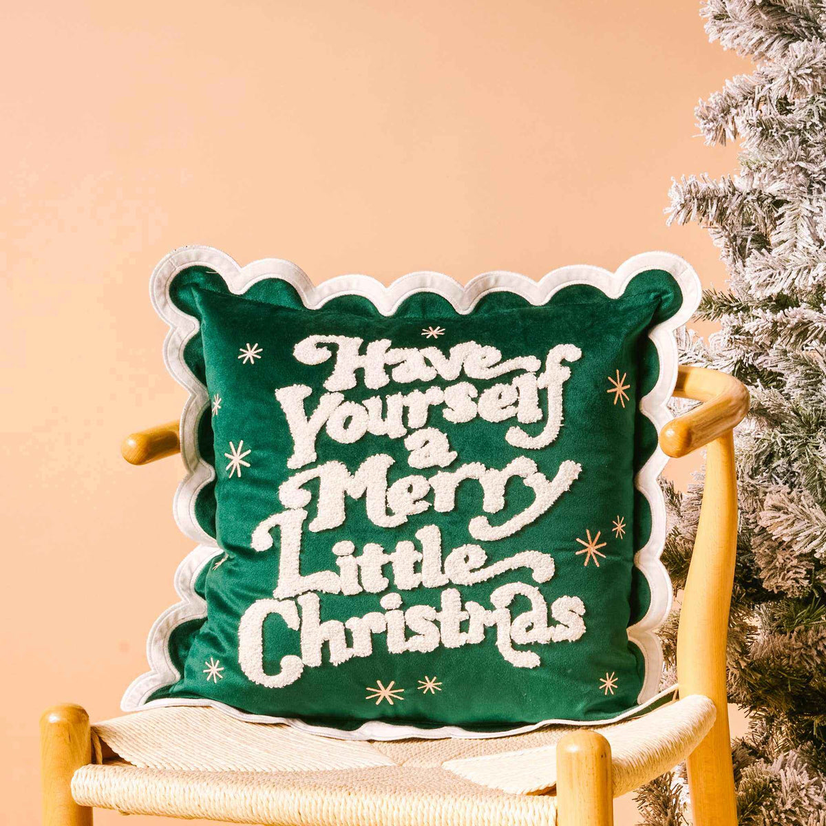 
                  
                    Scalloped square throw pillow with Merry Little Christmas text in green and white holiday design
                  
                