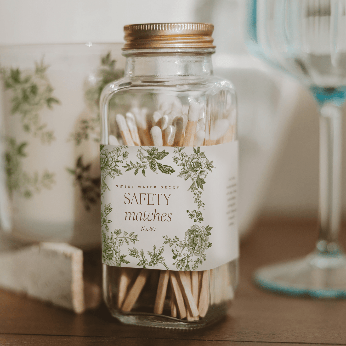 Green Delft White Tip safety matches in a decorative glass jar with Delft-inspired label