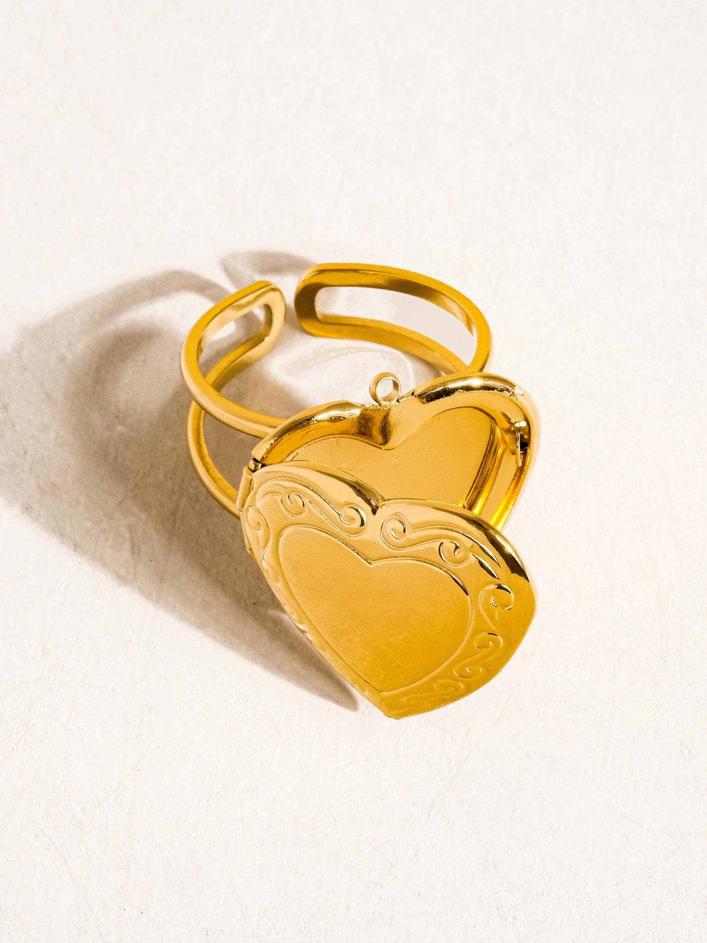 Sefina 18K Non-Tarnish Locket Heart Ring in yellow gold with adjustable band and engraved details