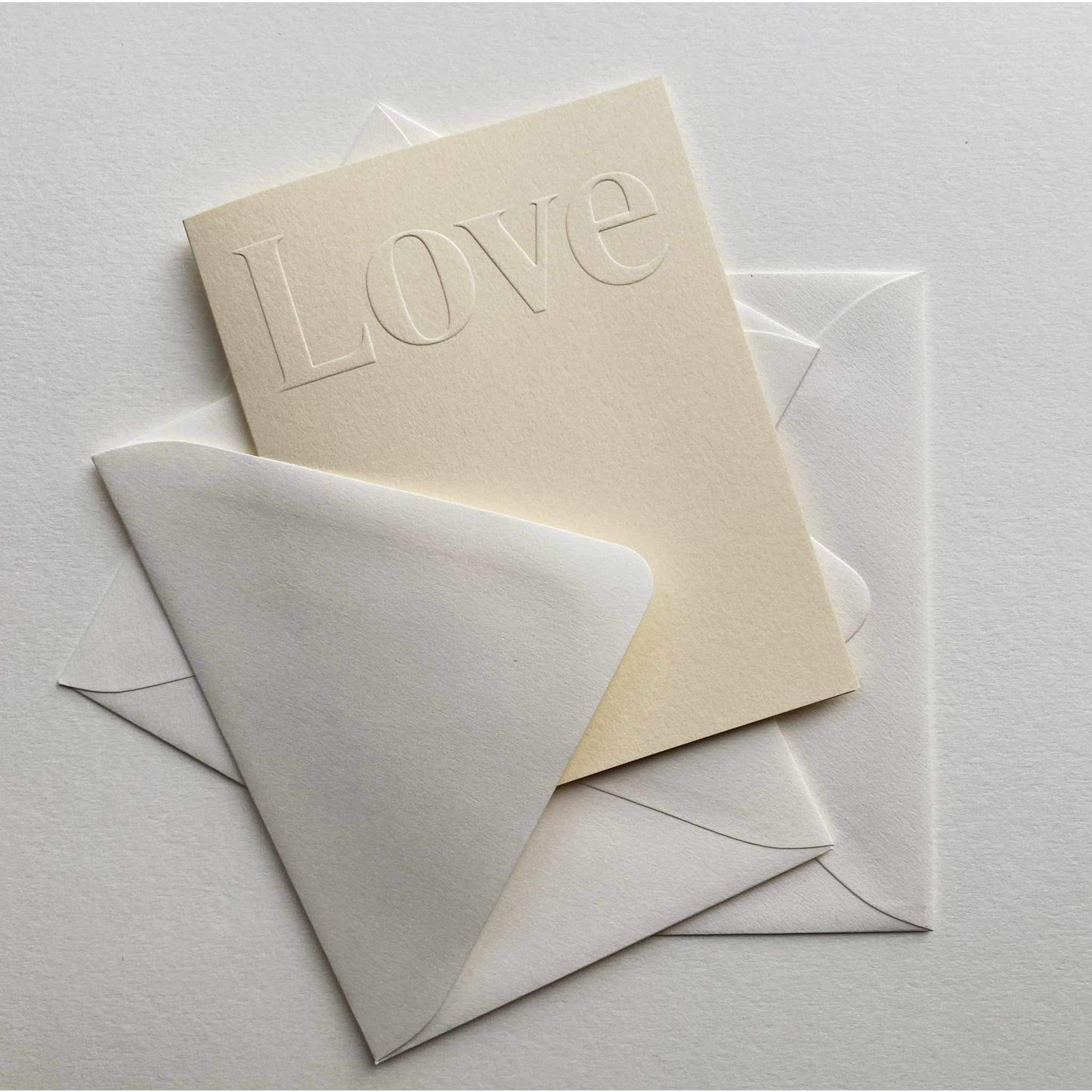 Love No. 19 creme single card with blind embossed cover and natural envelope