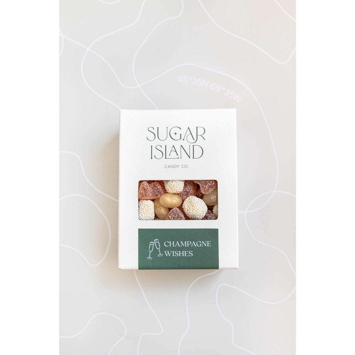 Champagne Wishes Candy Mix with prosecco gummy bears, champagne bubble candies, and shimmer jellybeans in a gift box