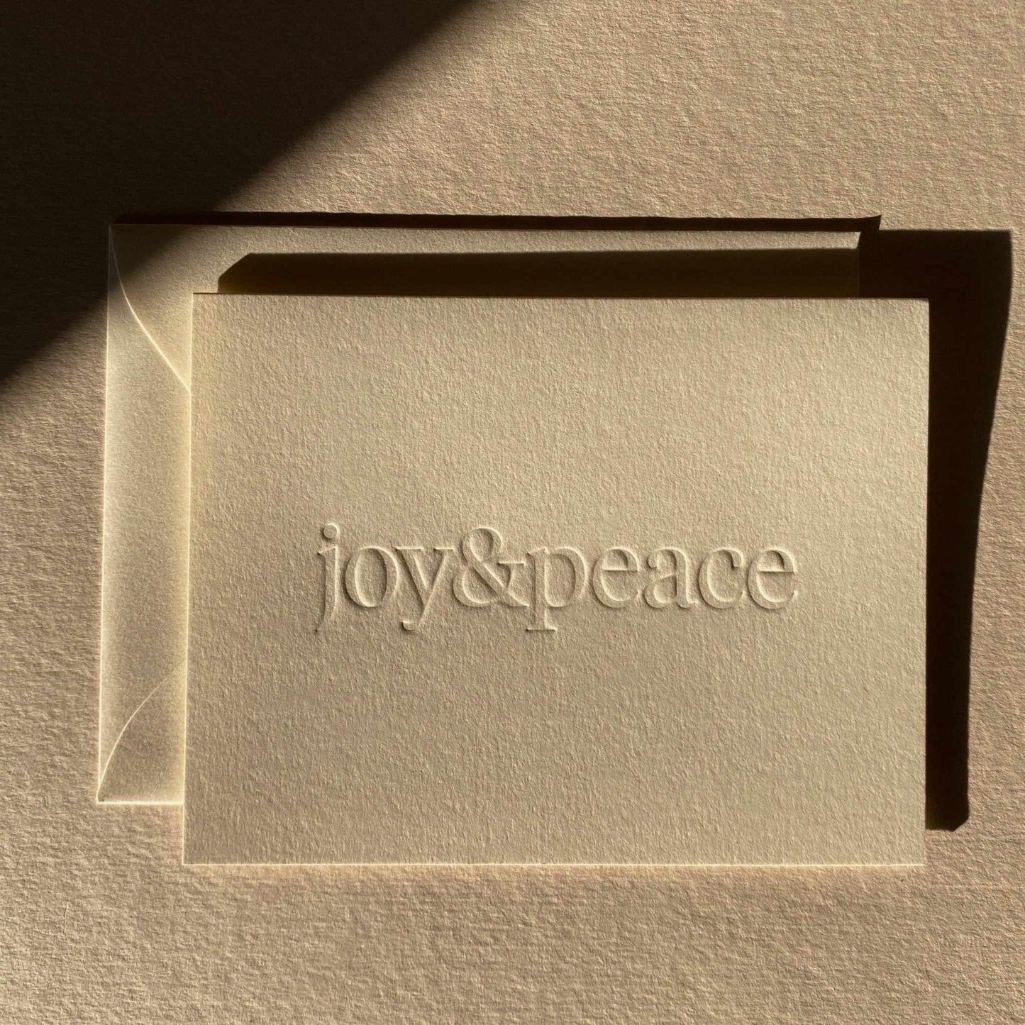 Joy & Peace embossed greeting card with natural envelope, olive color, blank interior, 4.25x5.5 inches, made in Los Angeles