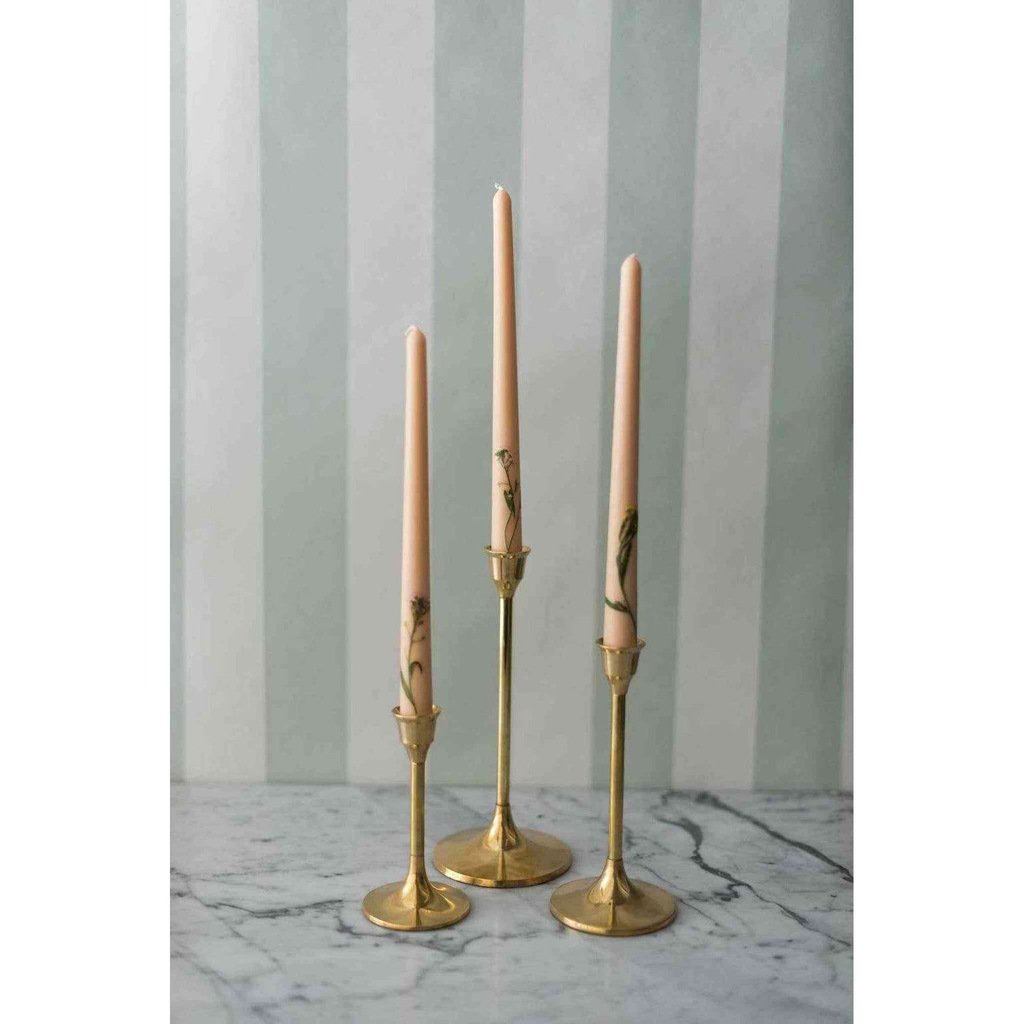 
                  
                    A set of three brass candlesticks. - Curated Home Decor
                  
                