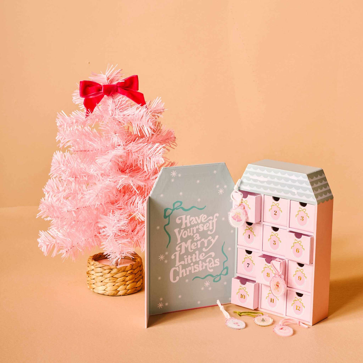 
                  
                    Pink mini artificial Christmas tree with red bow and pink ornament advent calendar bundle
                  
                