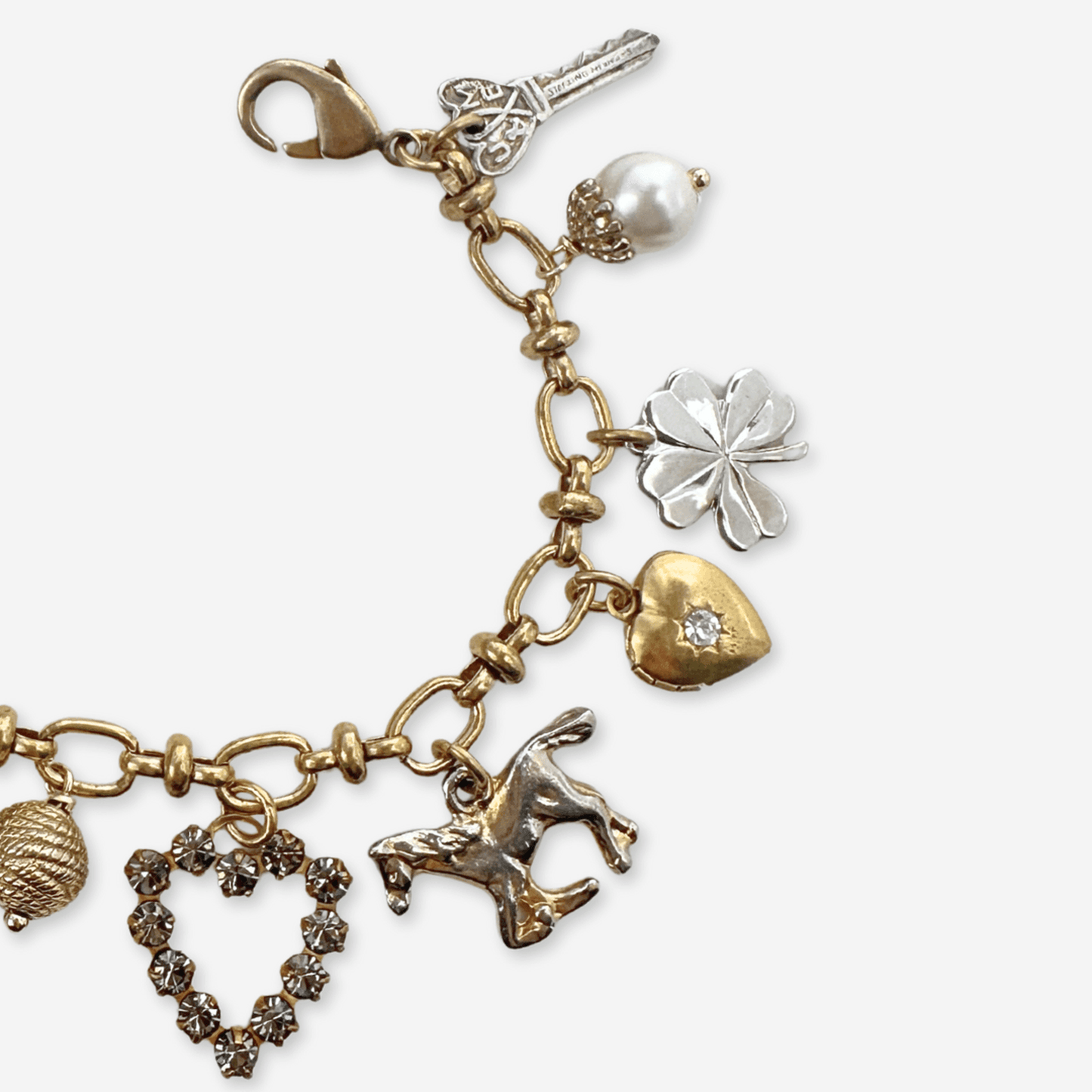 
                  
                    Repurposed vintage mixed metal charm bracelet - Curated Home Decor
                  
                
