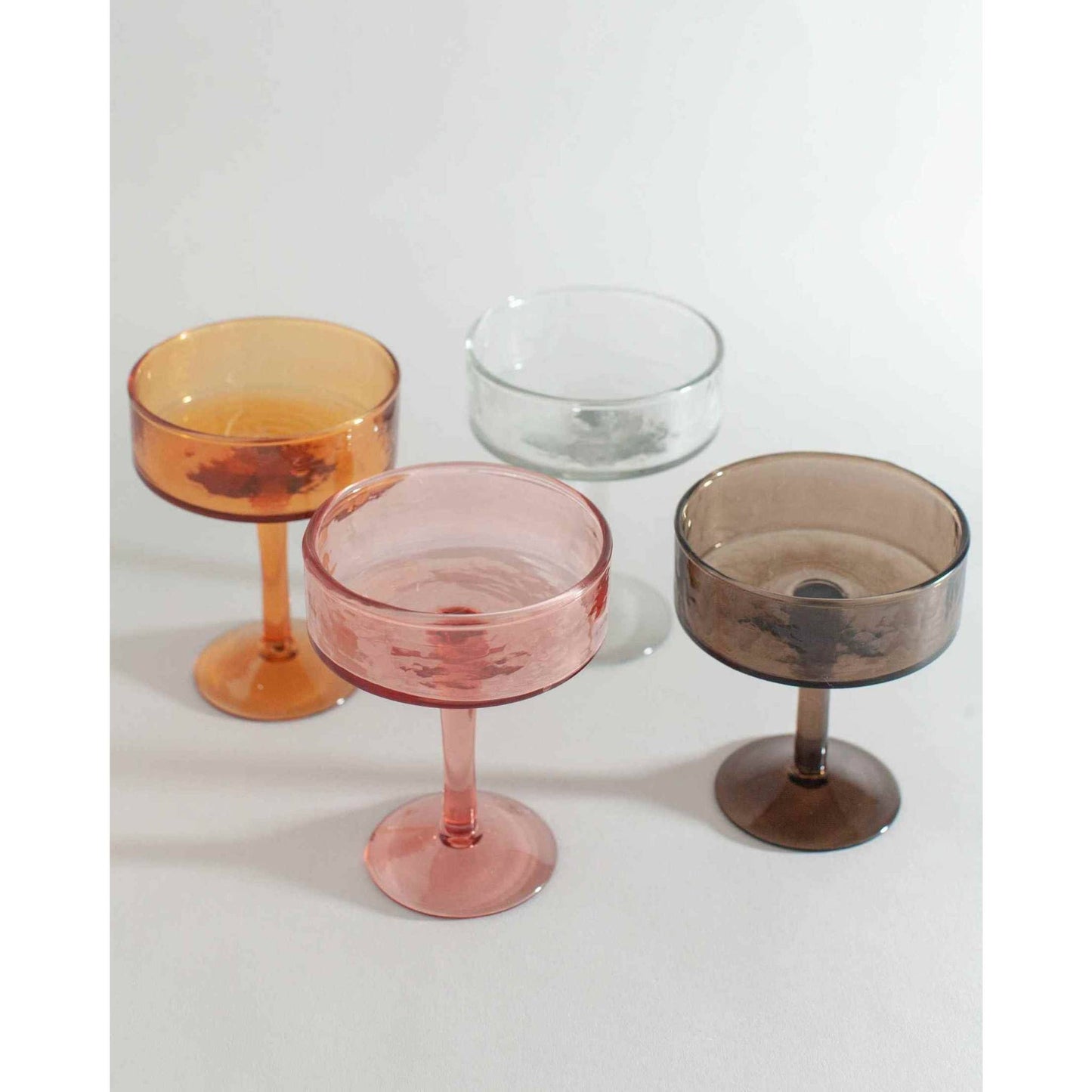
                  
                    Blush Handblown Hammered Coupe Mixed Beverage Glasses are sold individually. - Curated Home Decor
                  
                