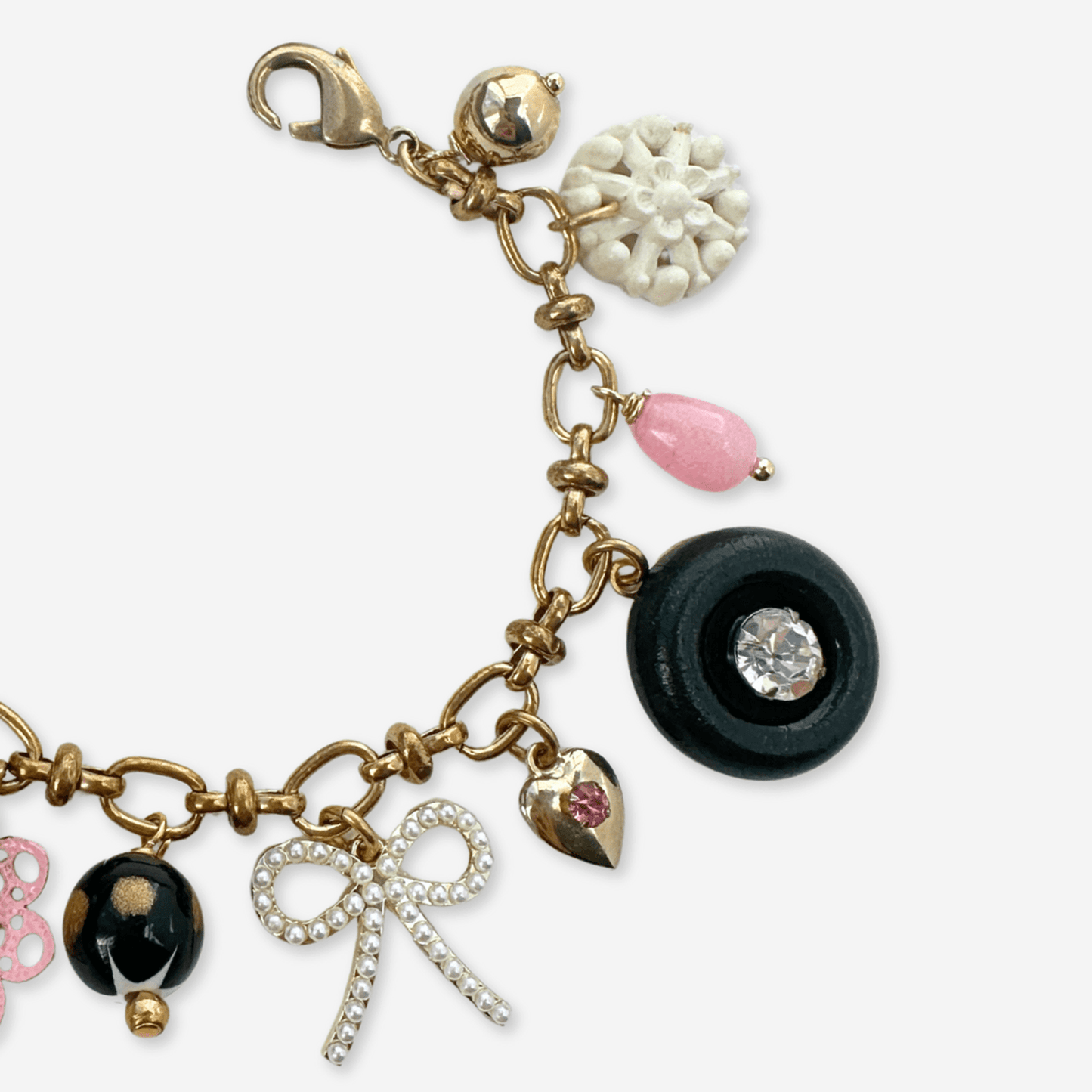 
                  
                    Repurposed vintage pink, black, and white mixed charm bracelet - Curated Home Decor
                  
                
